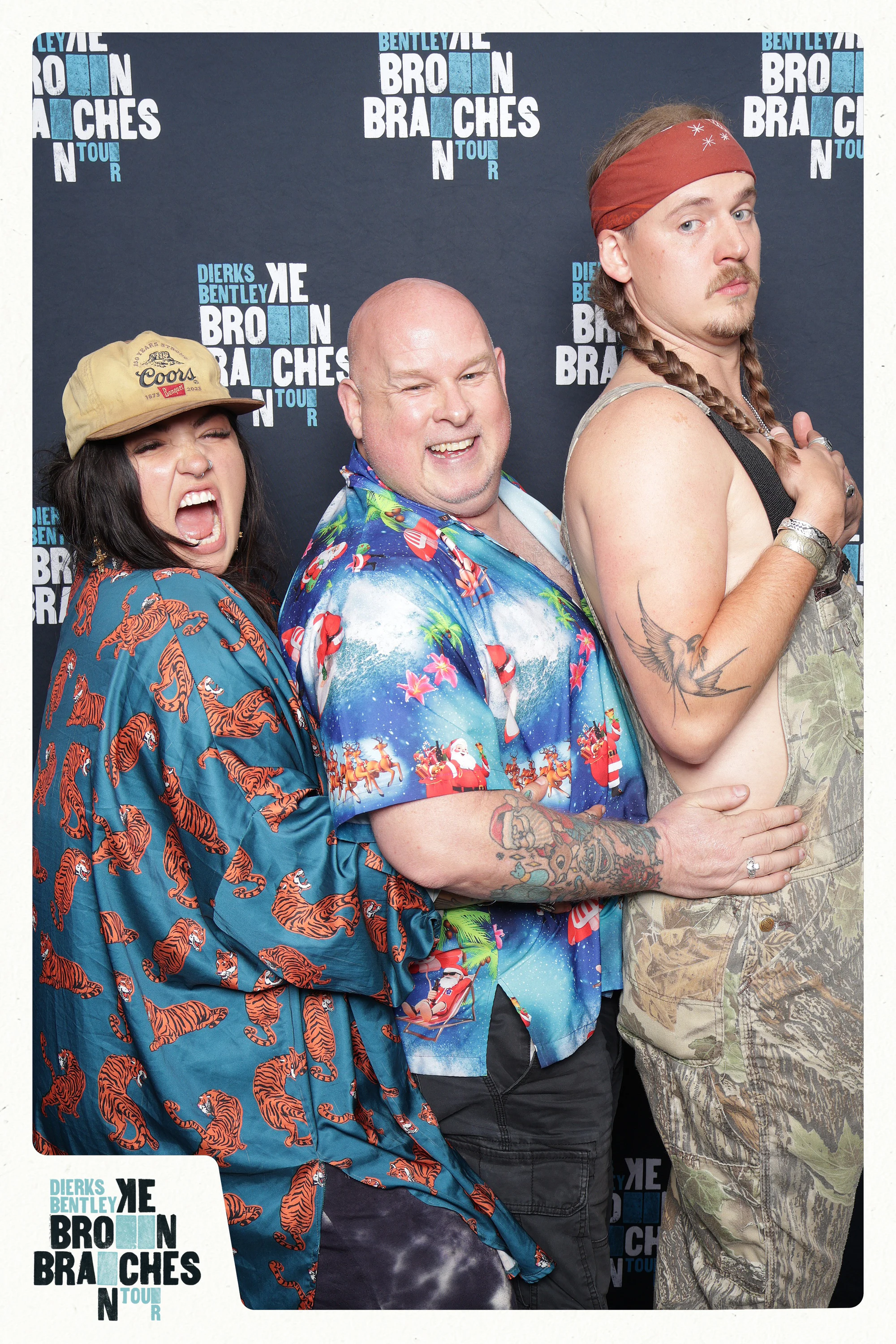 Three guests in a line, one mid-shout in a tiger-print robe, one in camo overalls at Dierks Bentley End of Tour Party