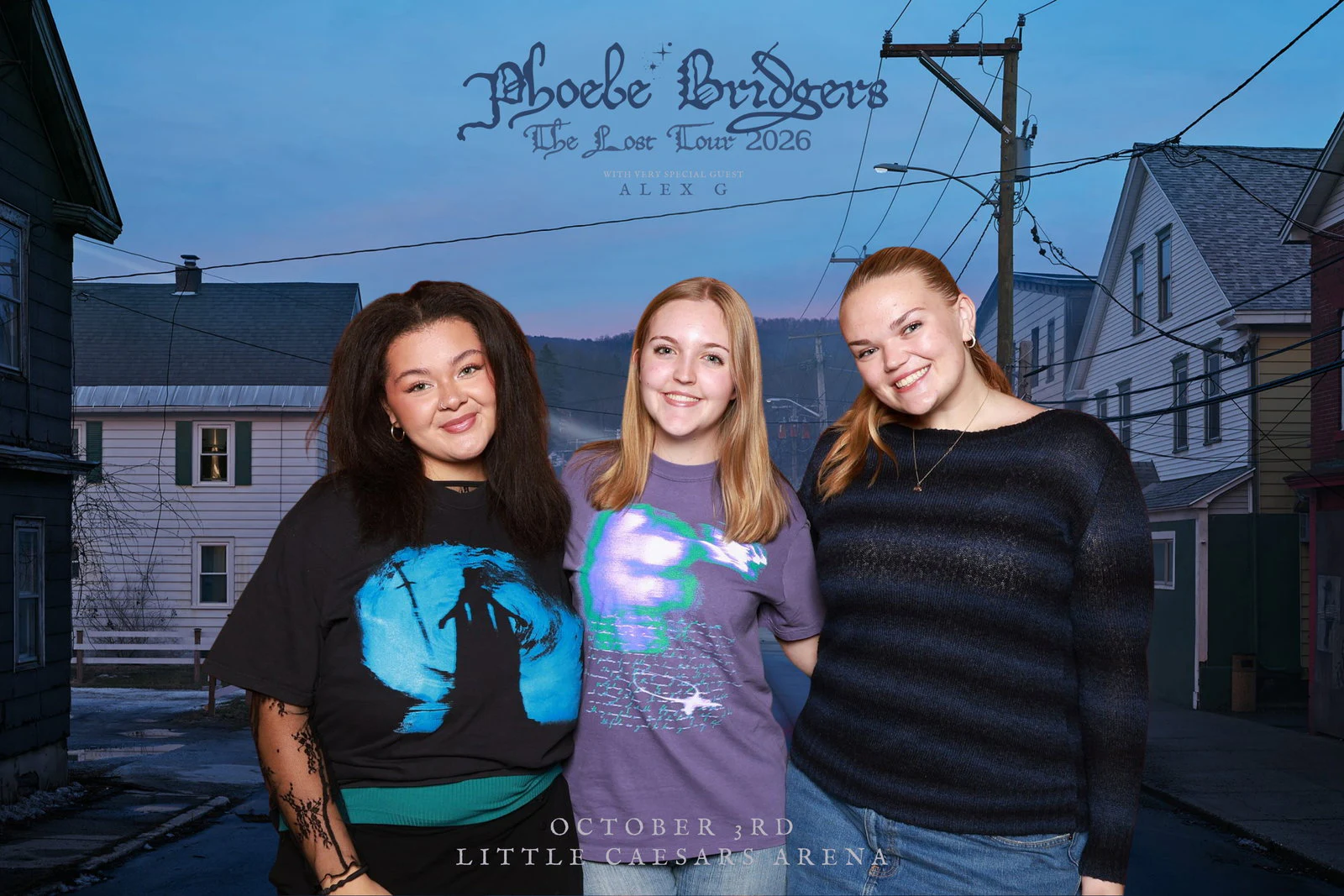 Three friends standing close and smiling, two in graphic tees and one in a striped sweater at Phoebe Bridgers with 313 Presents