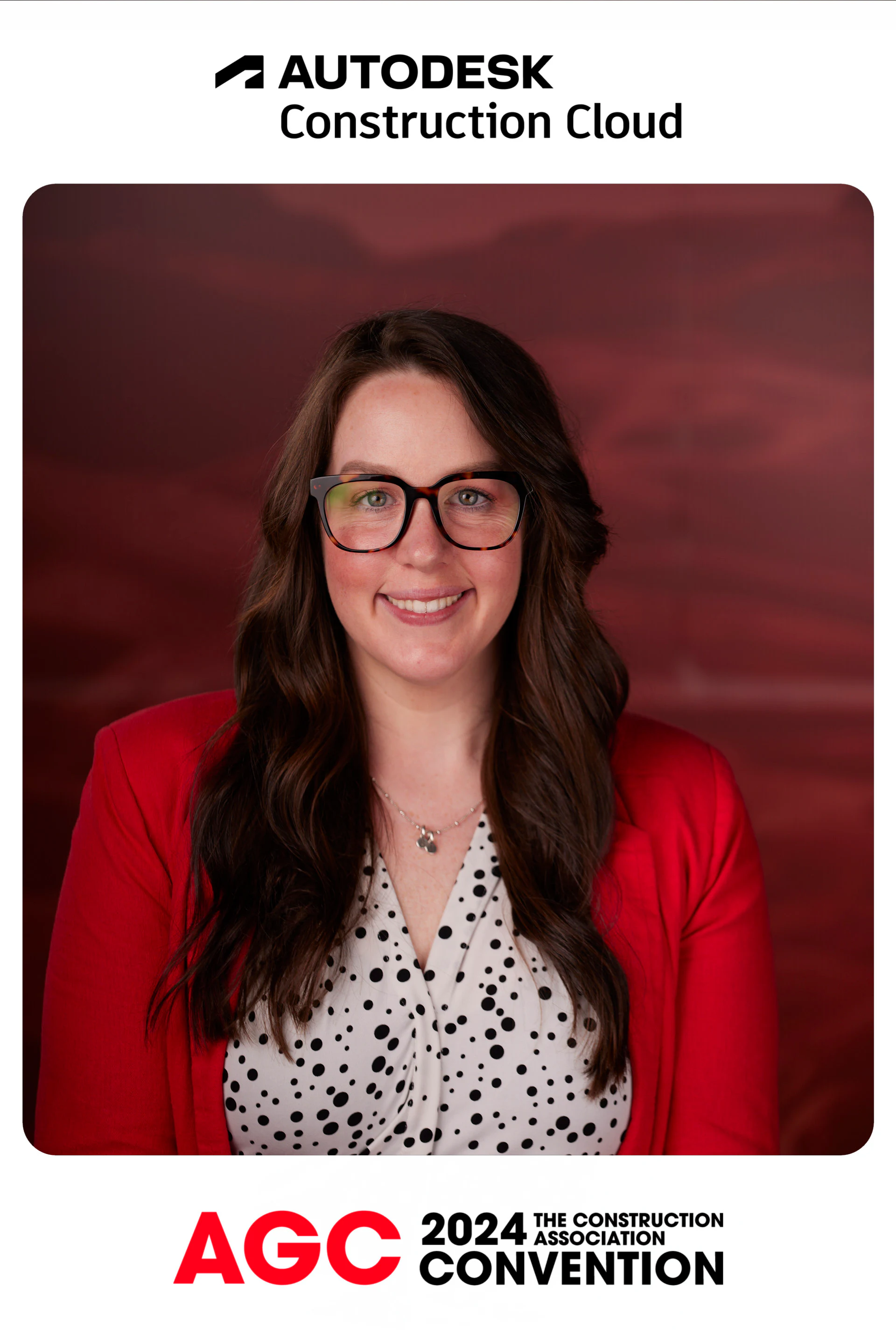 A guest in glasses and a red blazer smiling in her framed headshot at Autodesk at the AGC Annual Convention