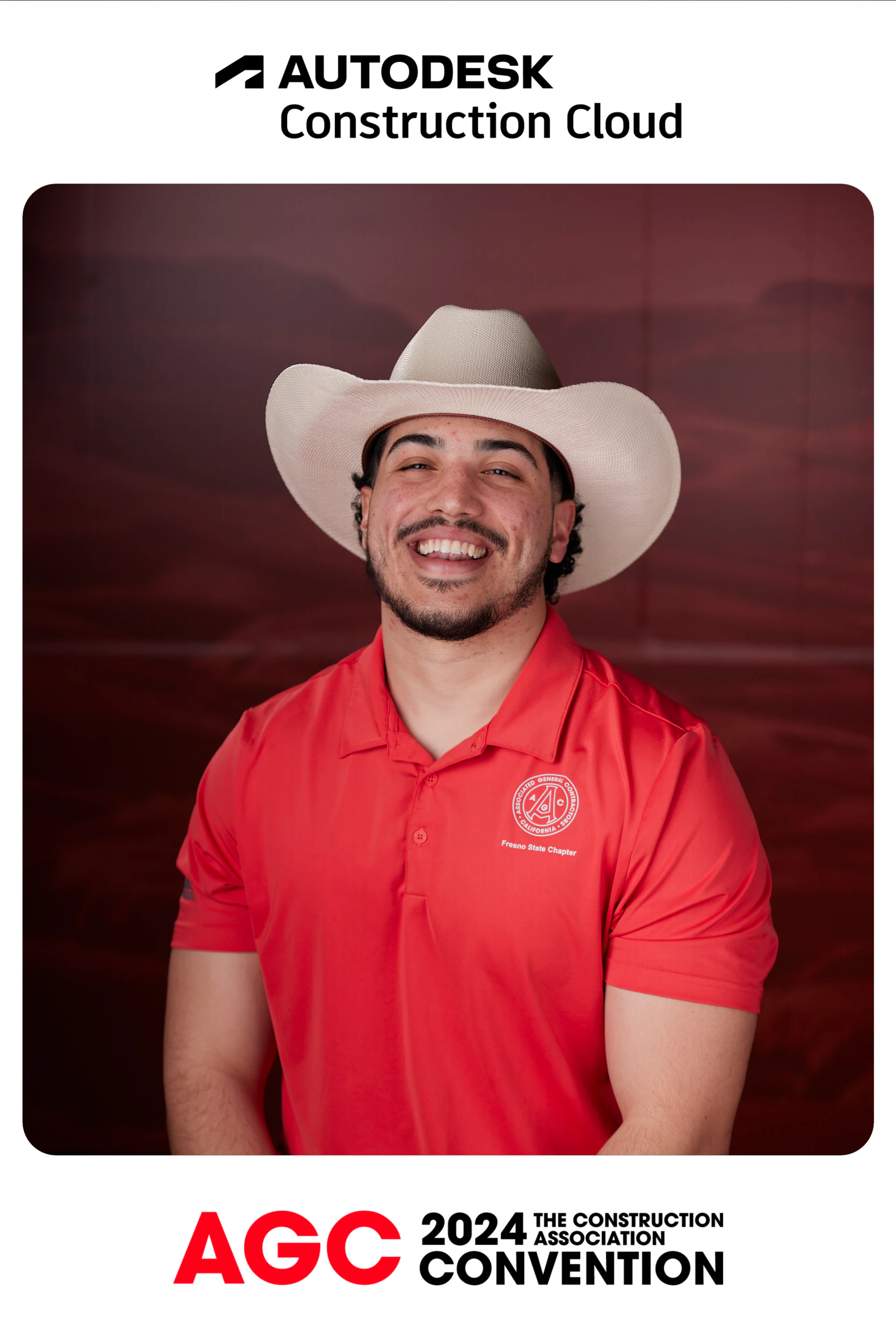 A guest in a white cowboy hat and red polo smiling in his framed headshot at Autodesk at the AGC Annual Convention