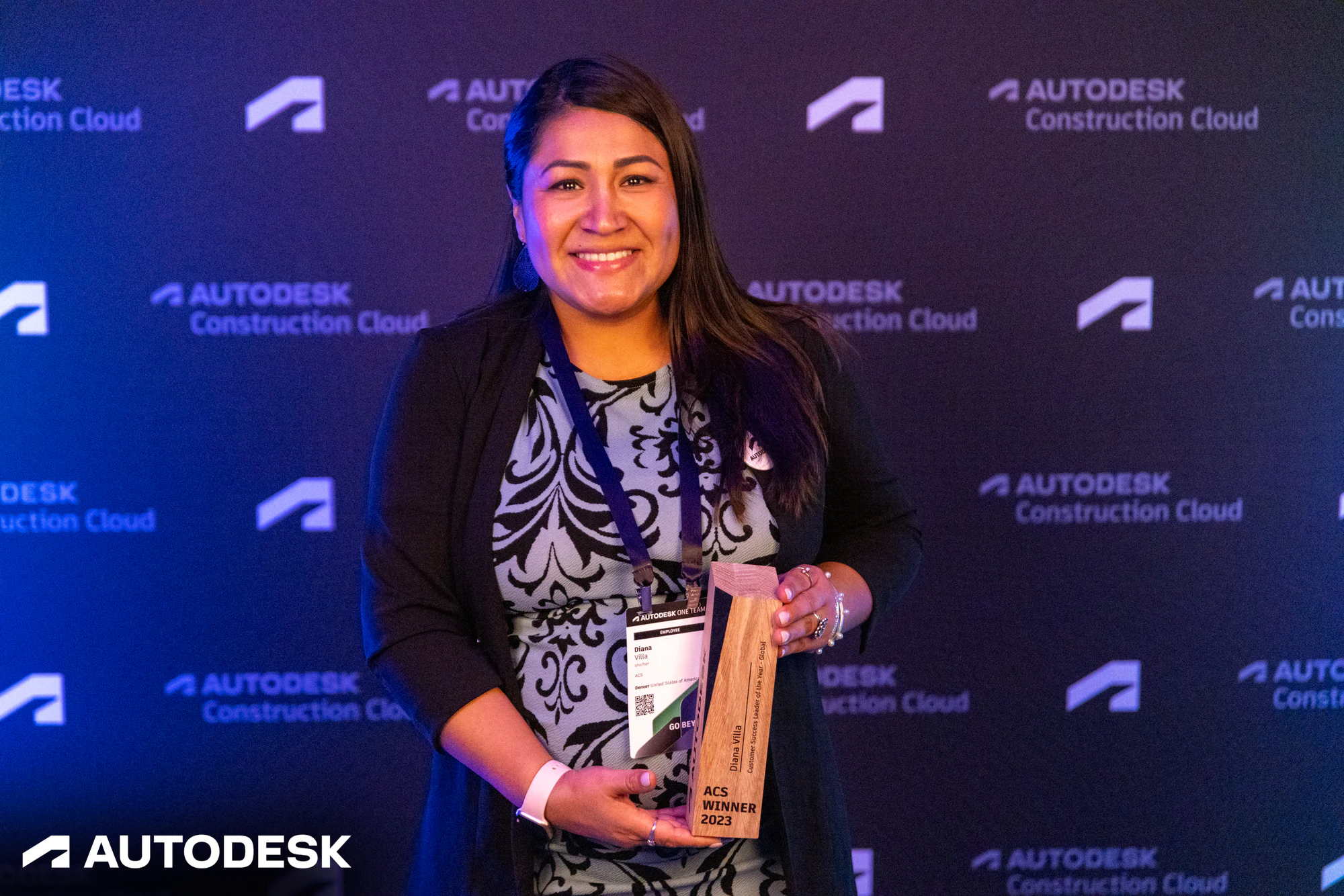 The winner with her trophy, a closer frame at the Autodesk OTC Awards 2023