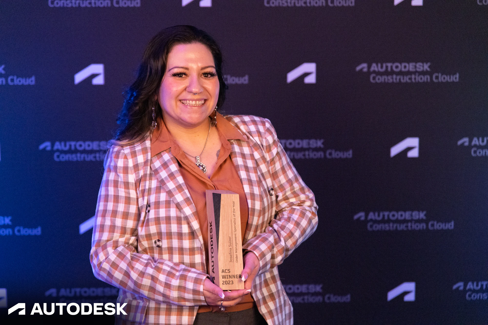 The winner with her trophy, a closer frame at the Autodesk OTC Awards 2023