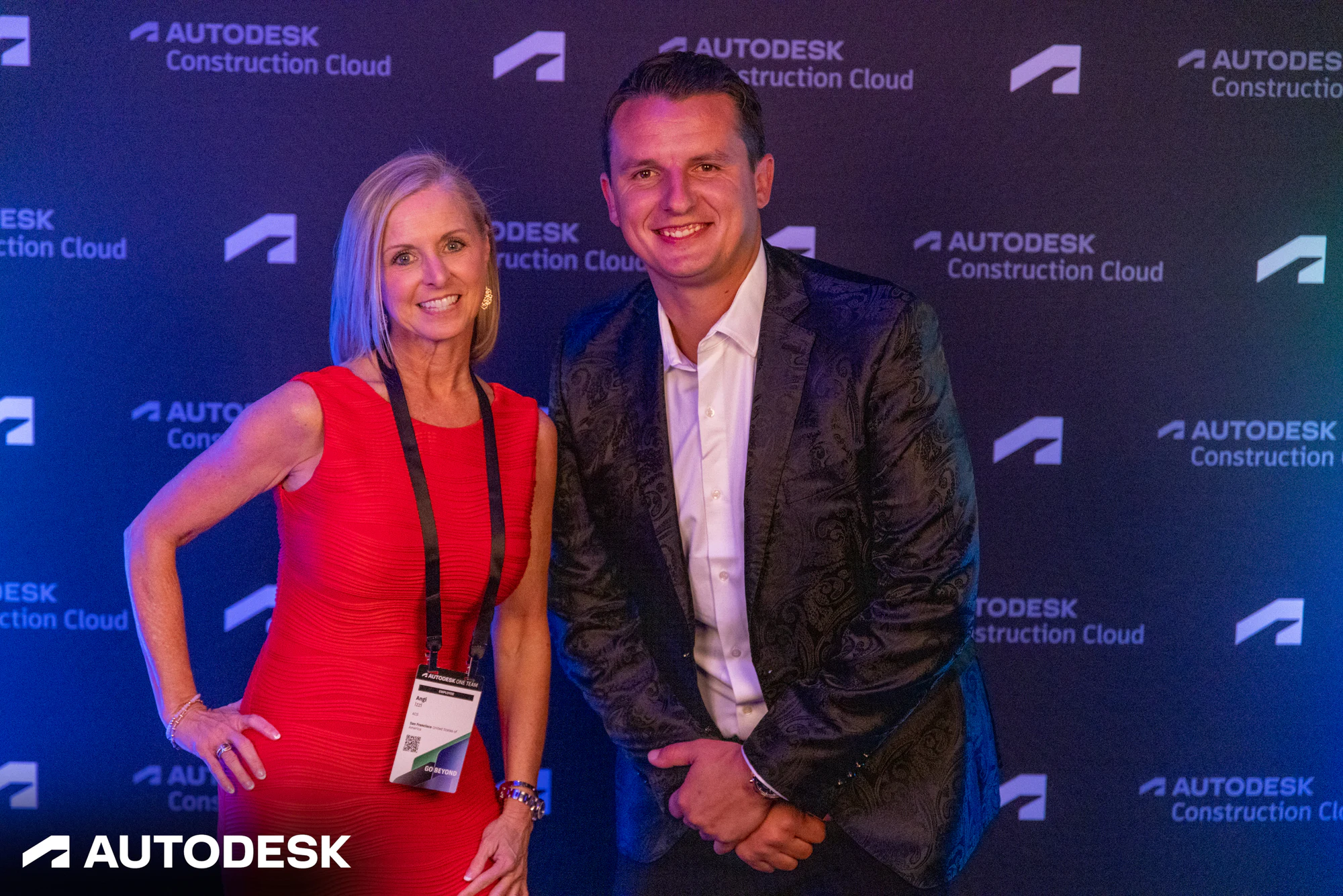Two guests posing together at the Autodesk backdrop at the Autodesk OTC Awards 2023