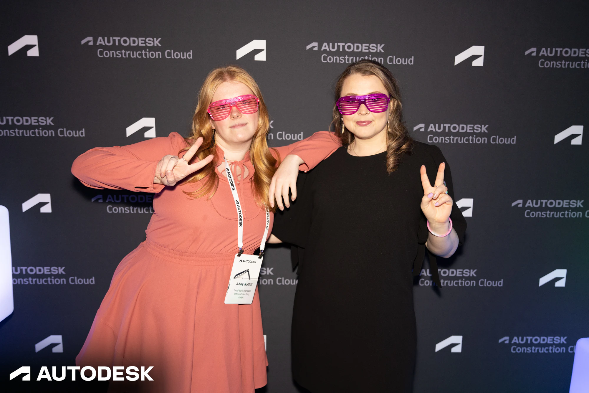 The two in pink sunglasses throwing peace signs at Autodesk Awards Atlanta 2023