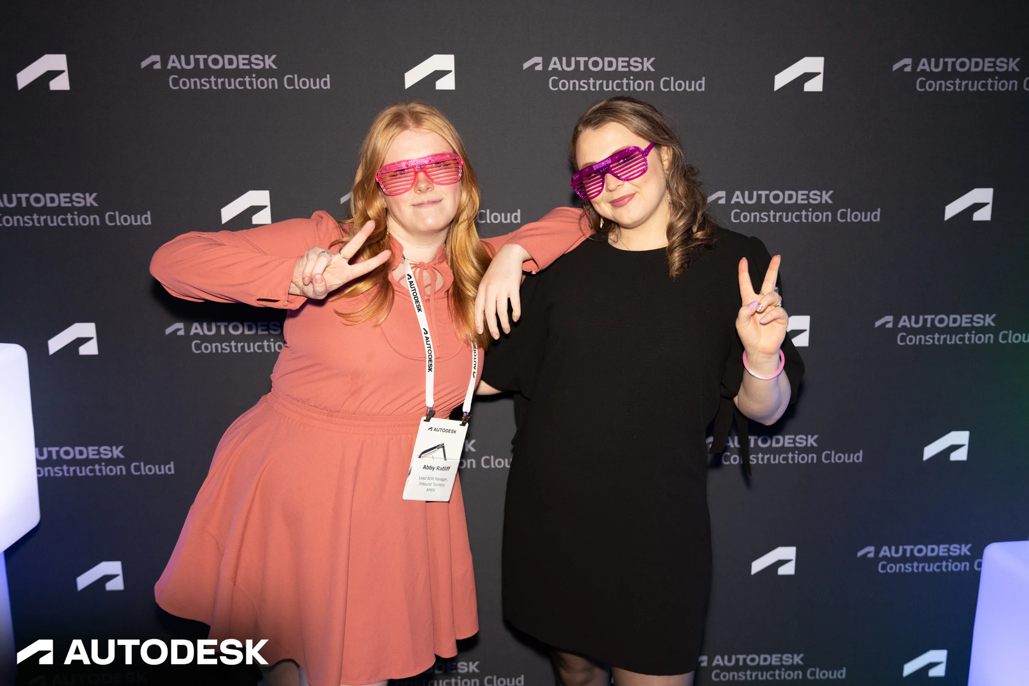 The two in sunglasses posing, one leaning on the other at Autodesk Awards Atlanta 2023
