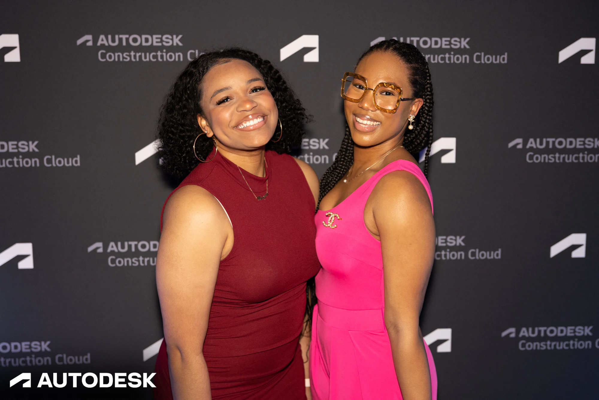 The two leaning in, smiling at Autodesk Awards Atlanta 2023
