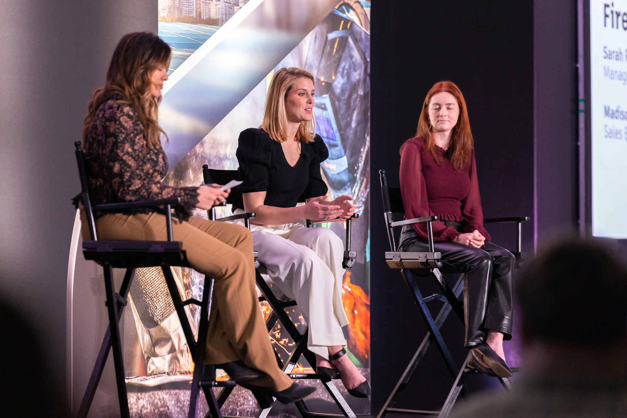 Three women on stools for a fireside chat on the Autodesk stage at Autodesk Awards Atlanta 2023