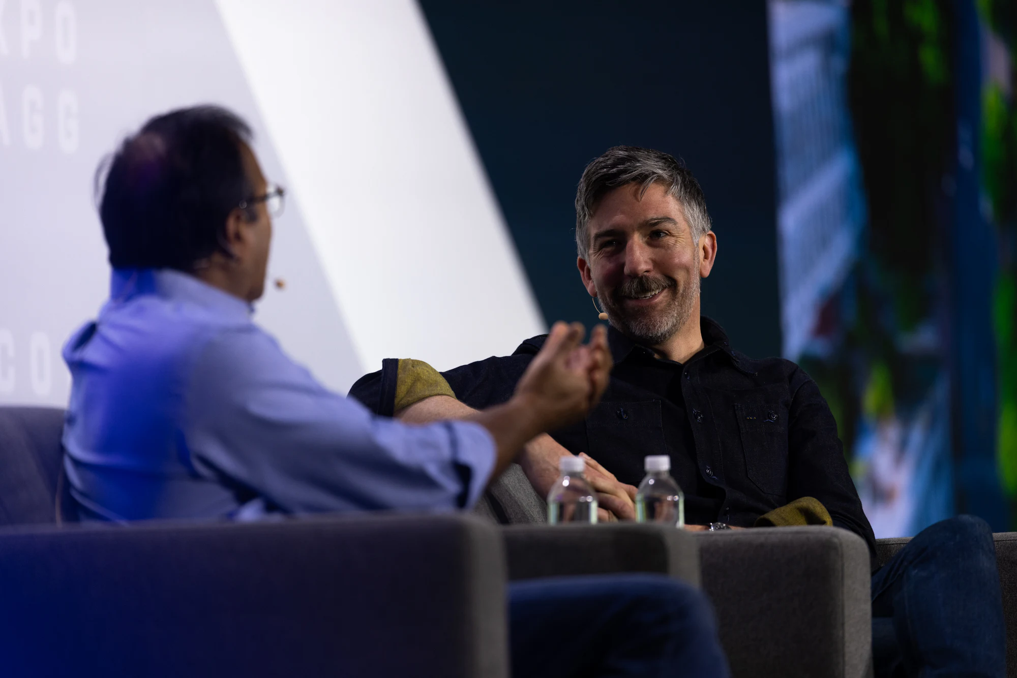 The keynote: the two speakers seated, one laughing at Autodesk at CONEXPO-CON/AGG 2026