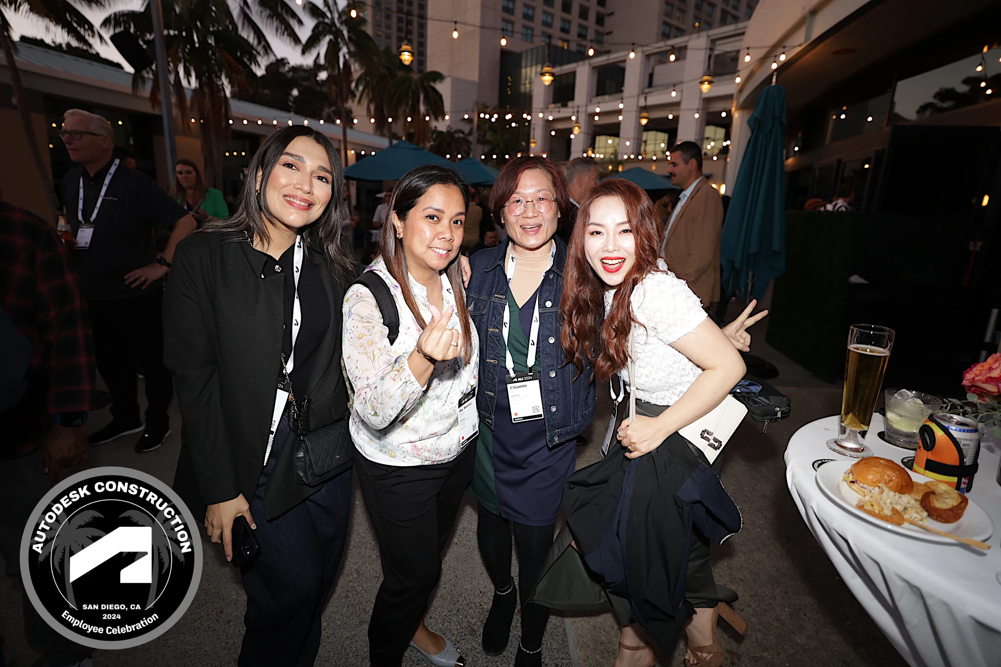 Four with peace signs, tight and happy at Autodesk University 2024