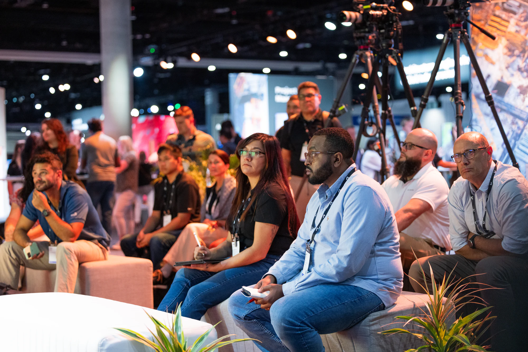 Attendees on the lounge benches listening to the talk at Autodesk University 2024