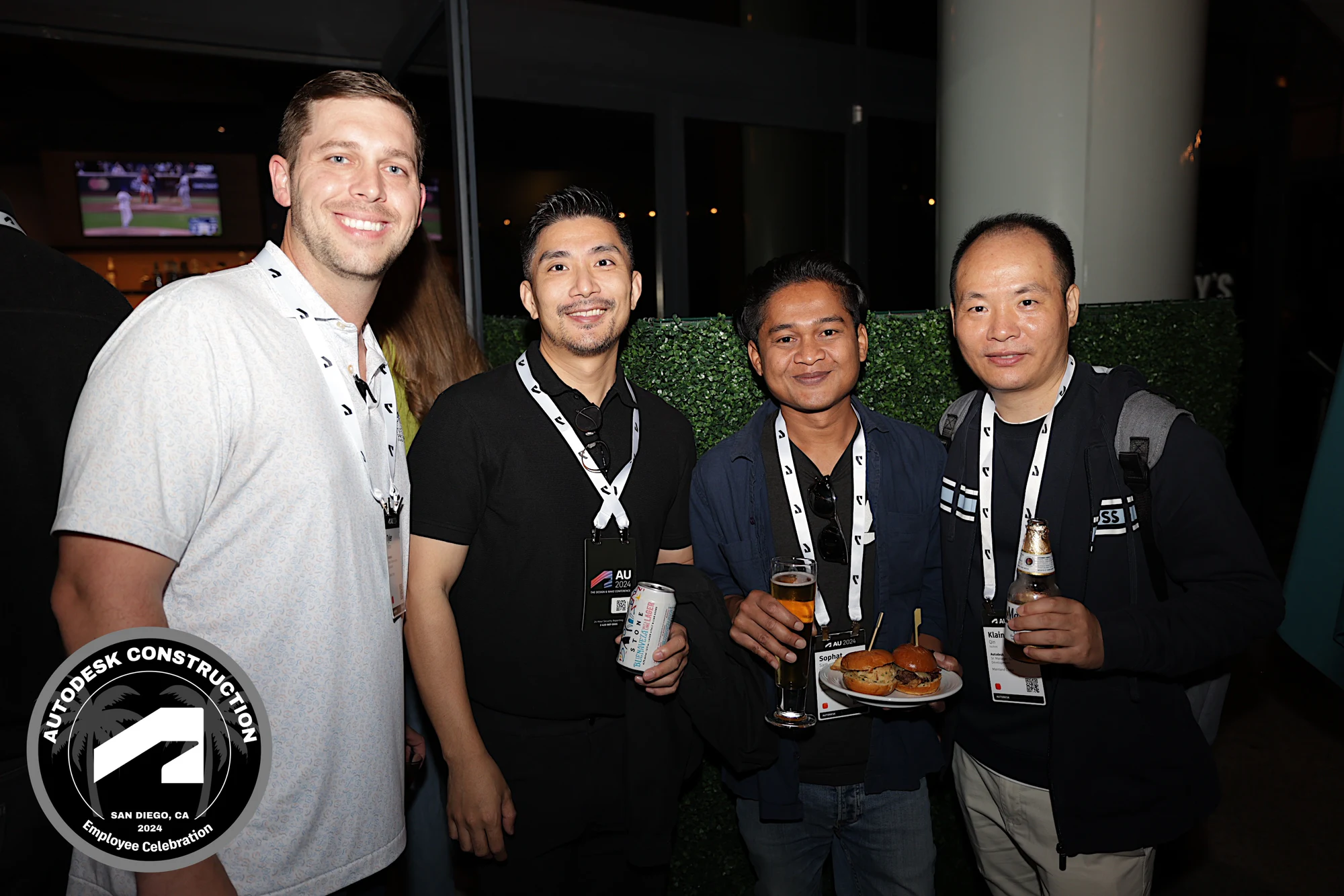 The four coworkers smiling, a closer frame at Autodesk University 2024