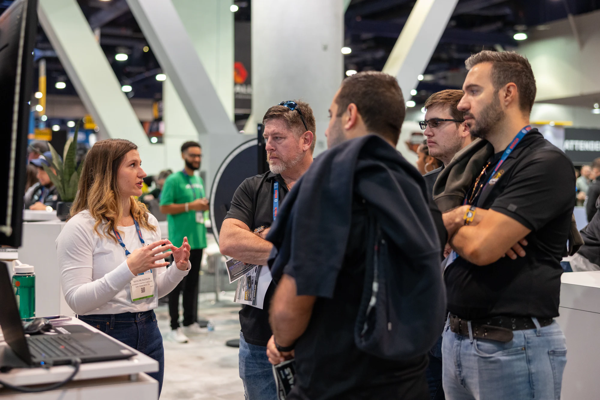 She explains while the visitors listen, arms crossed at Autodesk at World of Concrete 2024