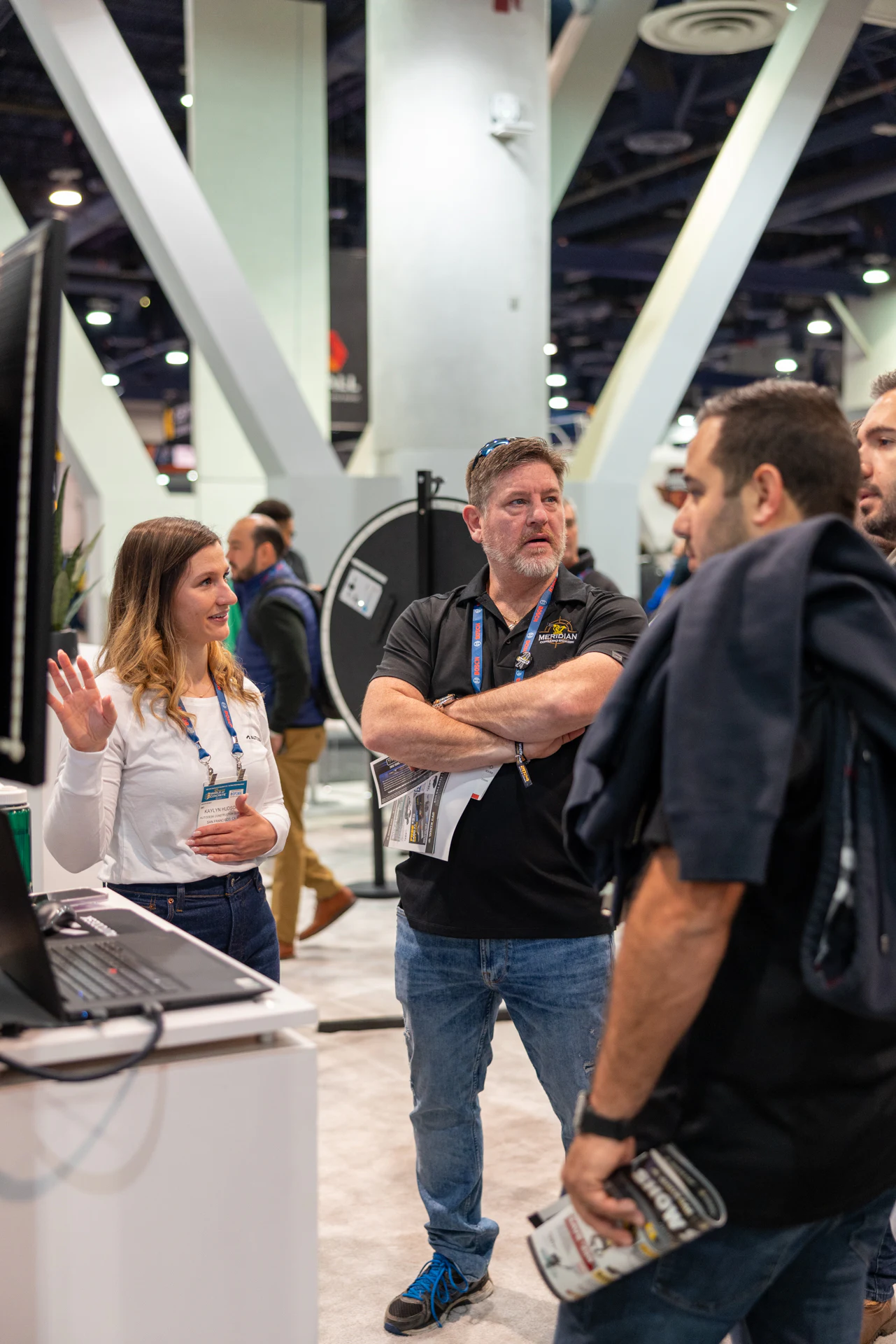 The conversation at the demo station seen from further back at Autodesk at World of Concrete 2024