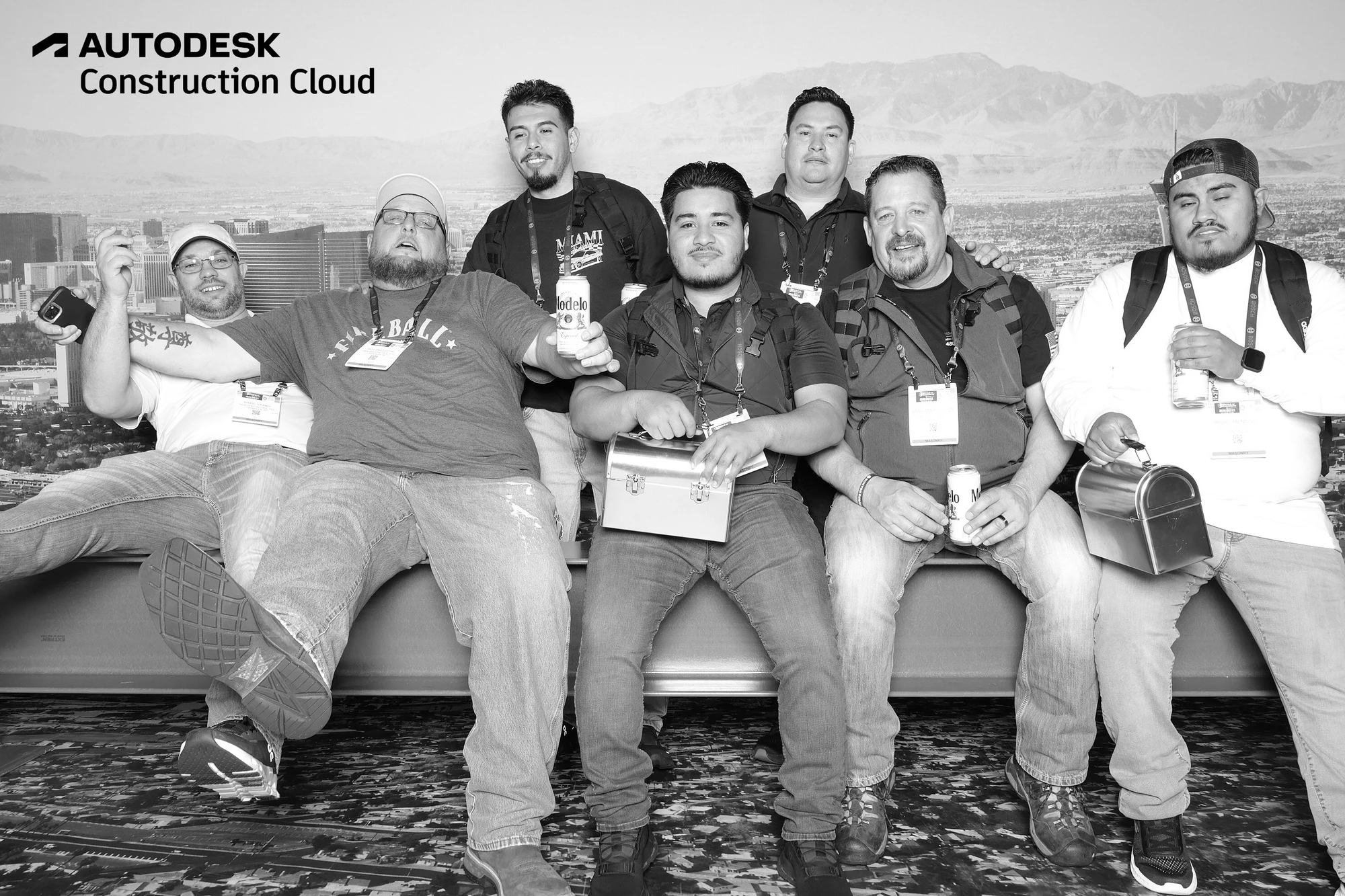 One guest leaning back on the beam with his feet up while the others smile at Autodesk at World of Concrete 2025