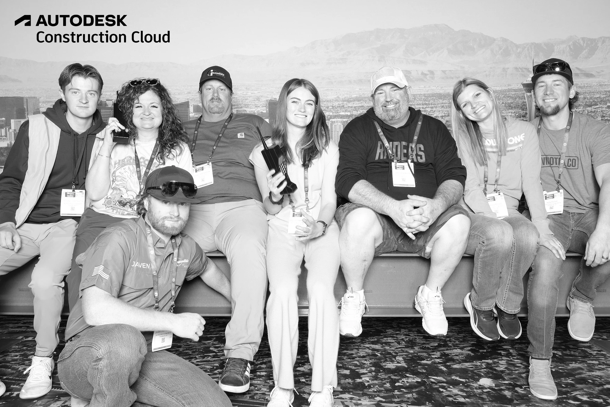 Eight guests on and in front of the beam, one kneeling at the front at Autodesk at World of Concrete 2025