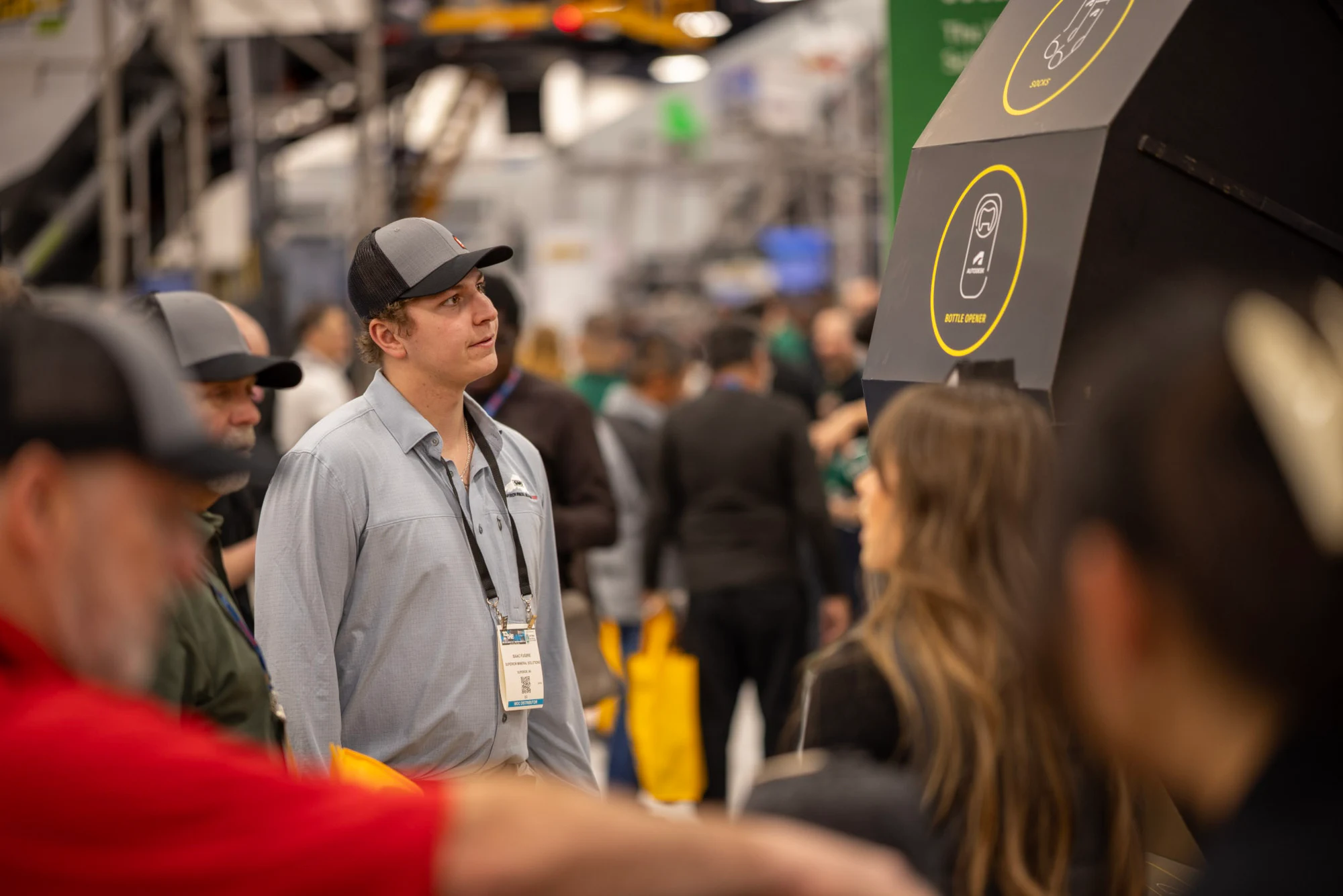 A visitor in a grey shirt and cap watching the prize spinner at Autodesk at World of Concrete 2026