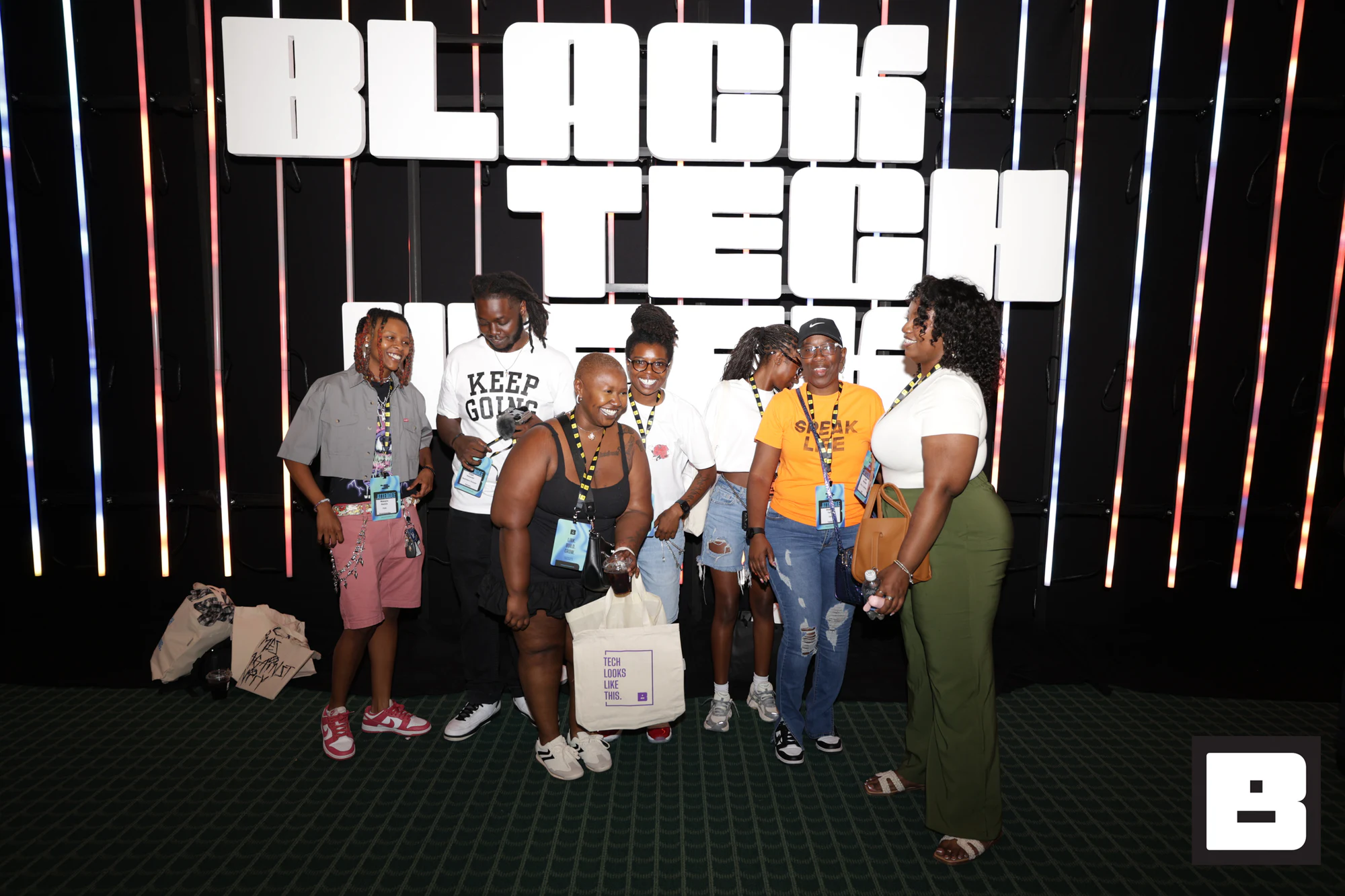 Six guests in front of the lit Black Tech Week letter wall at Black Tech Week 2025