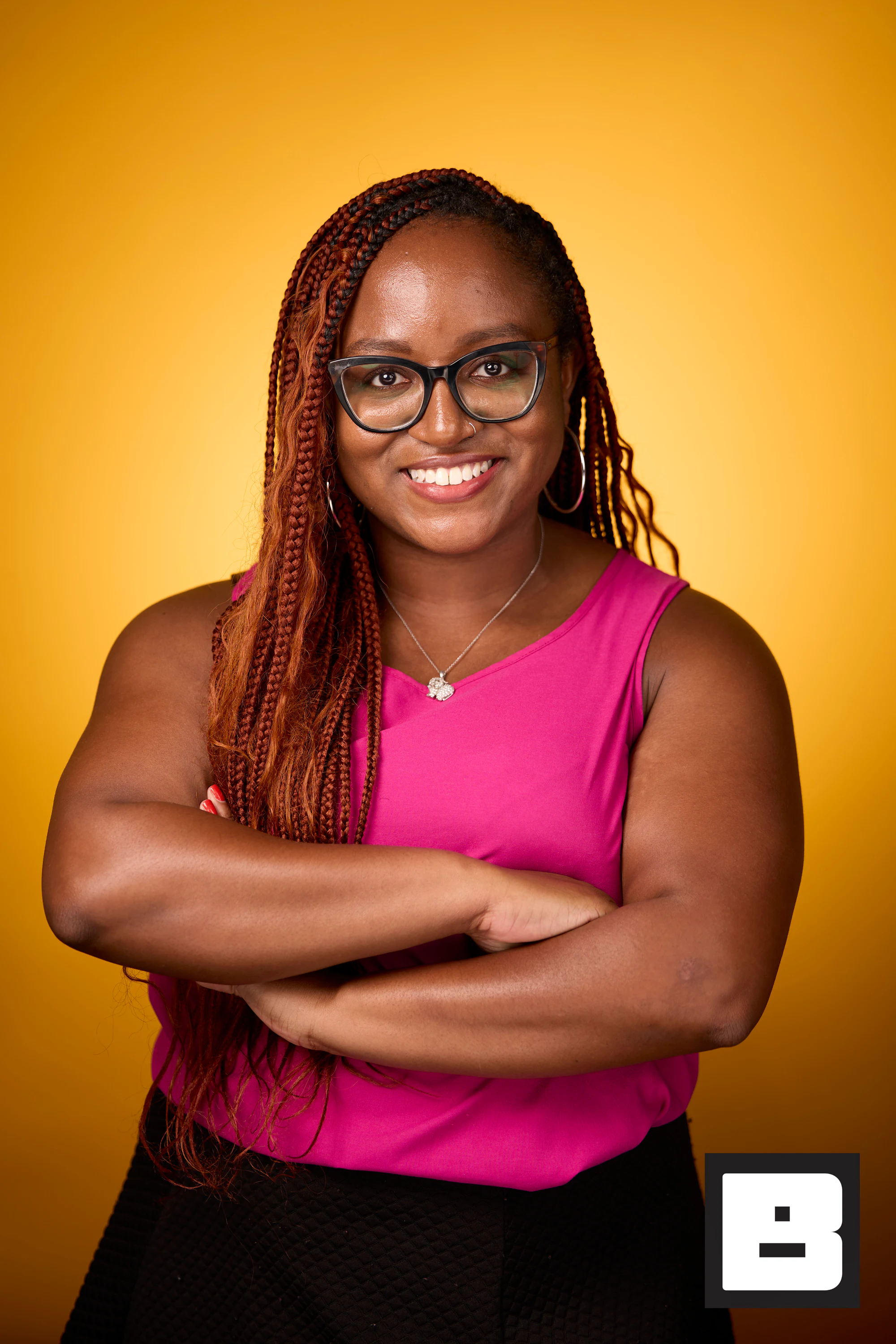 Pink top, arms crossed, smiling at P&G Confidence Lab at Black Tech Week
