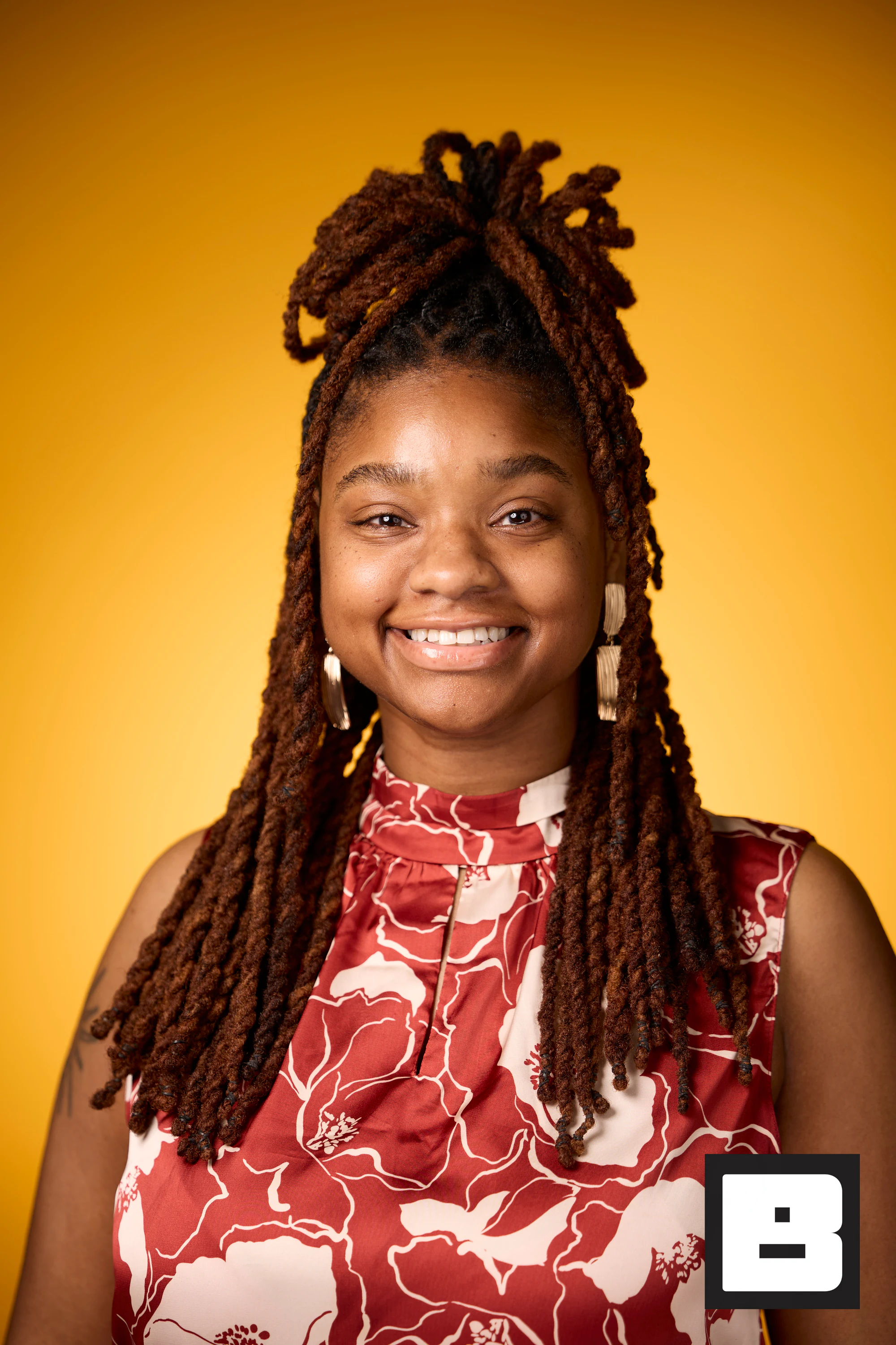 Floral top and locs, wide open smile at P&G Confidence Lab at Black Tech Week