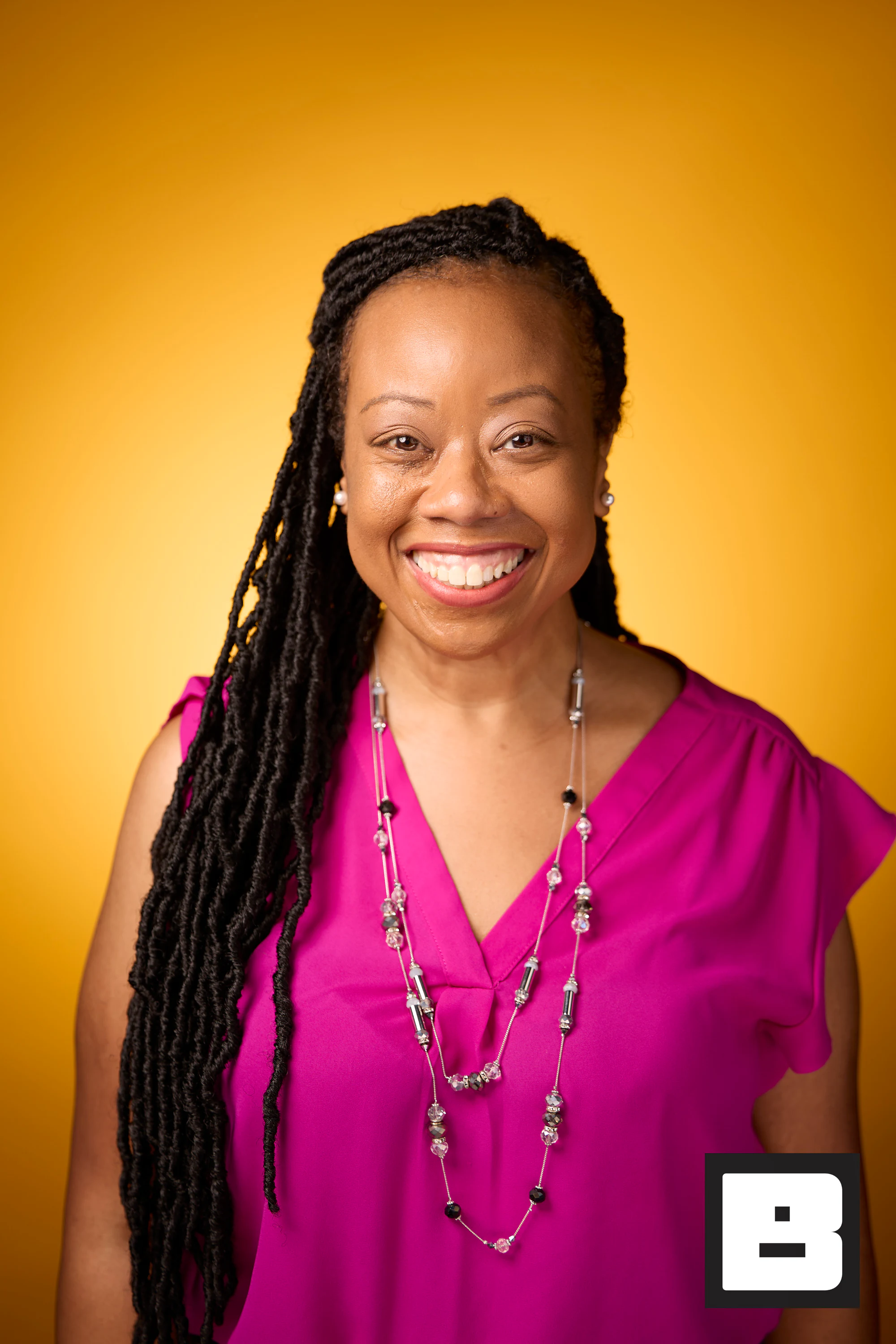 Magenta top, locs, big easy smile at P&G Confidence Lab at Black Tech Week