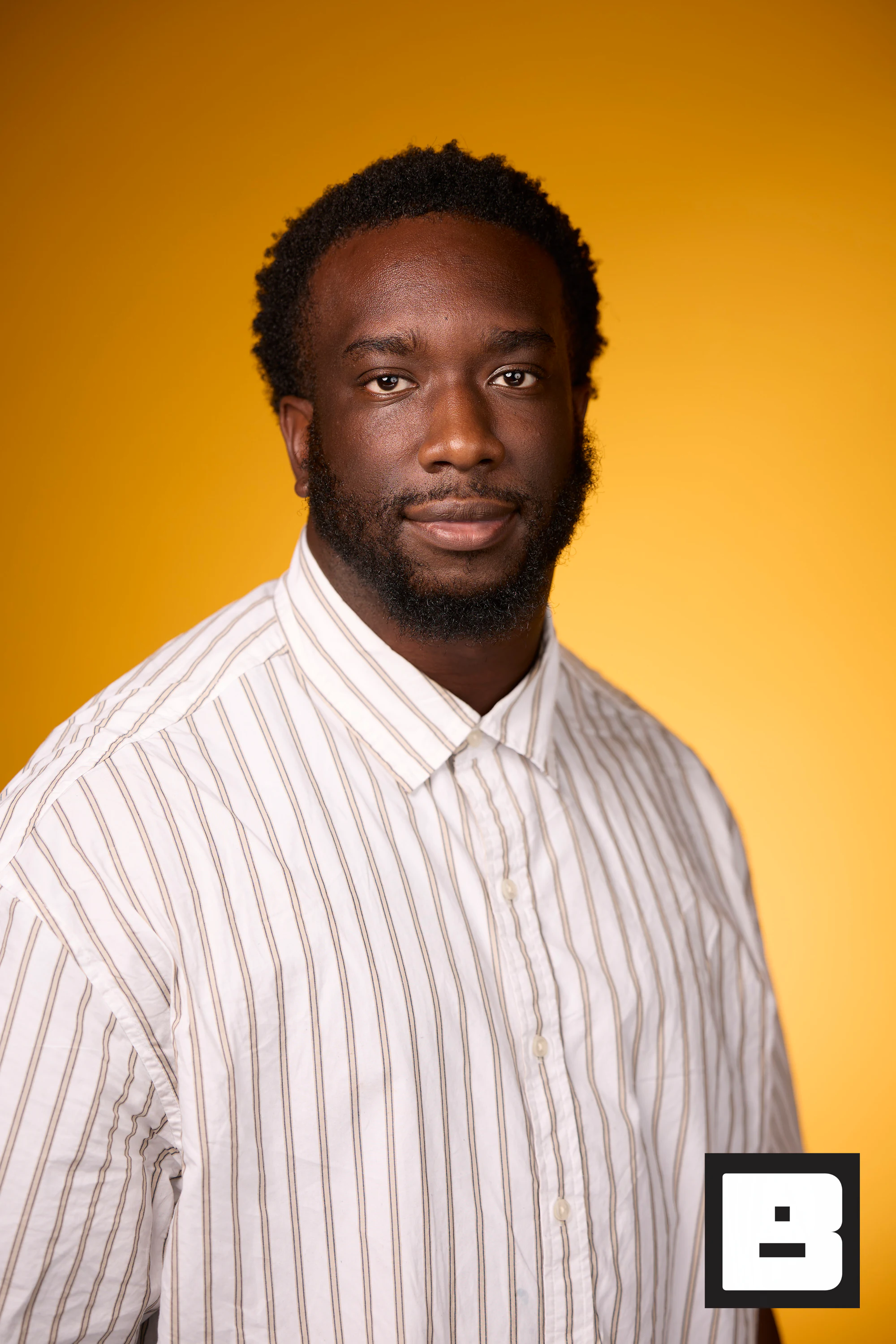 Striped shirt, calm smile at P&G Confidence Lab at Black Tech Week