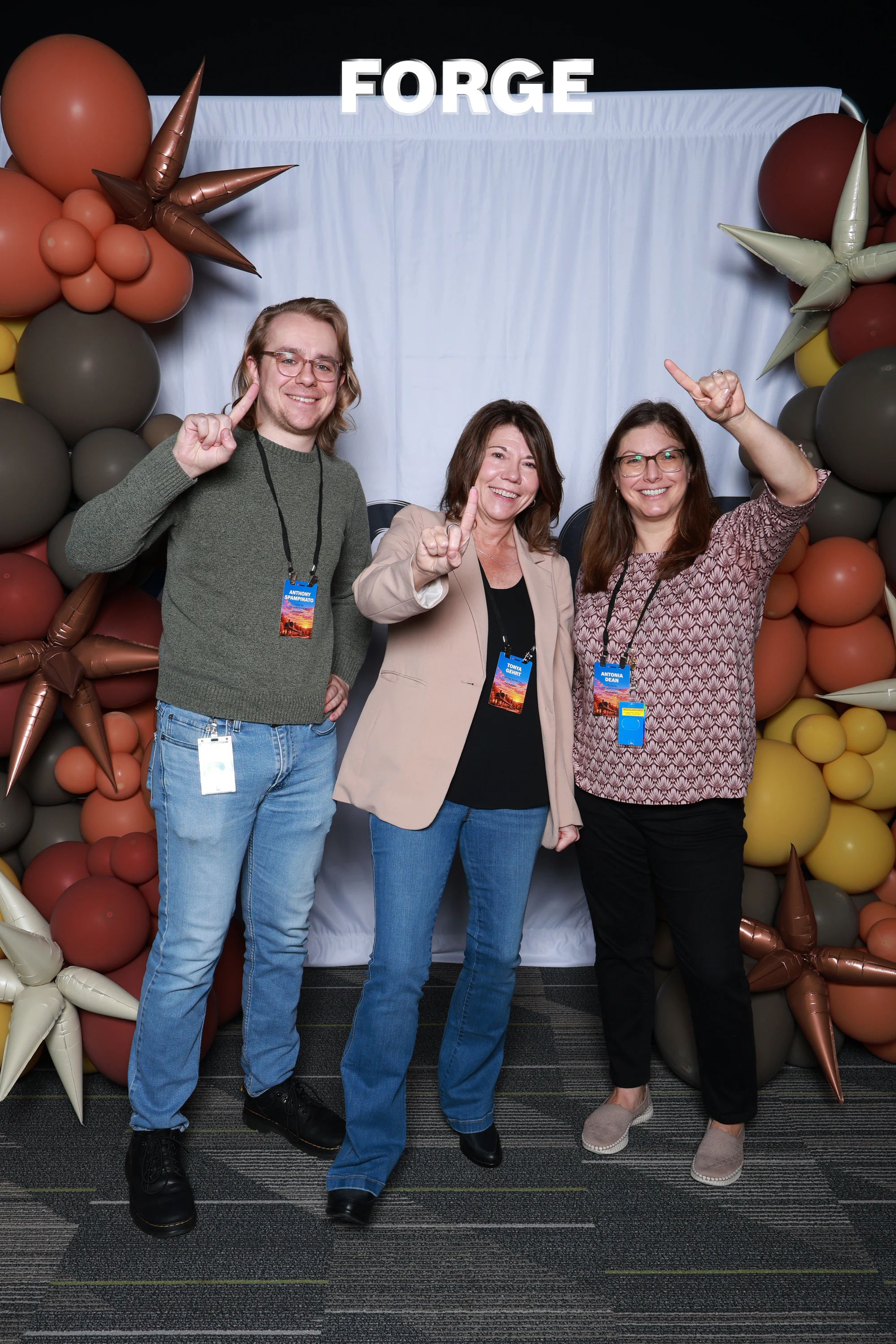 The three again, pointing up and giving a thumbs-up at Bosch FORGE 2026