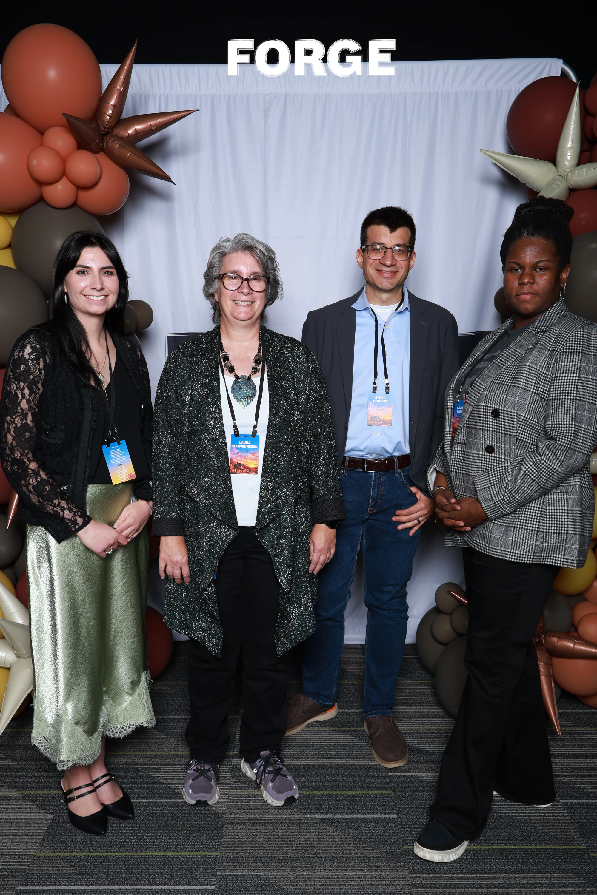 Four guests in a row in front of the FORGE drape at Bosch FORGE 2026