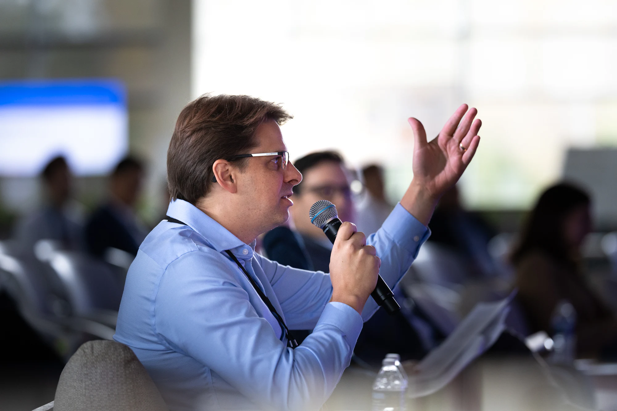 A judge asking a question into the mic from the front row at Bosch FORGE 2026