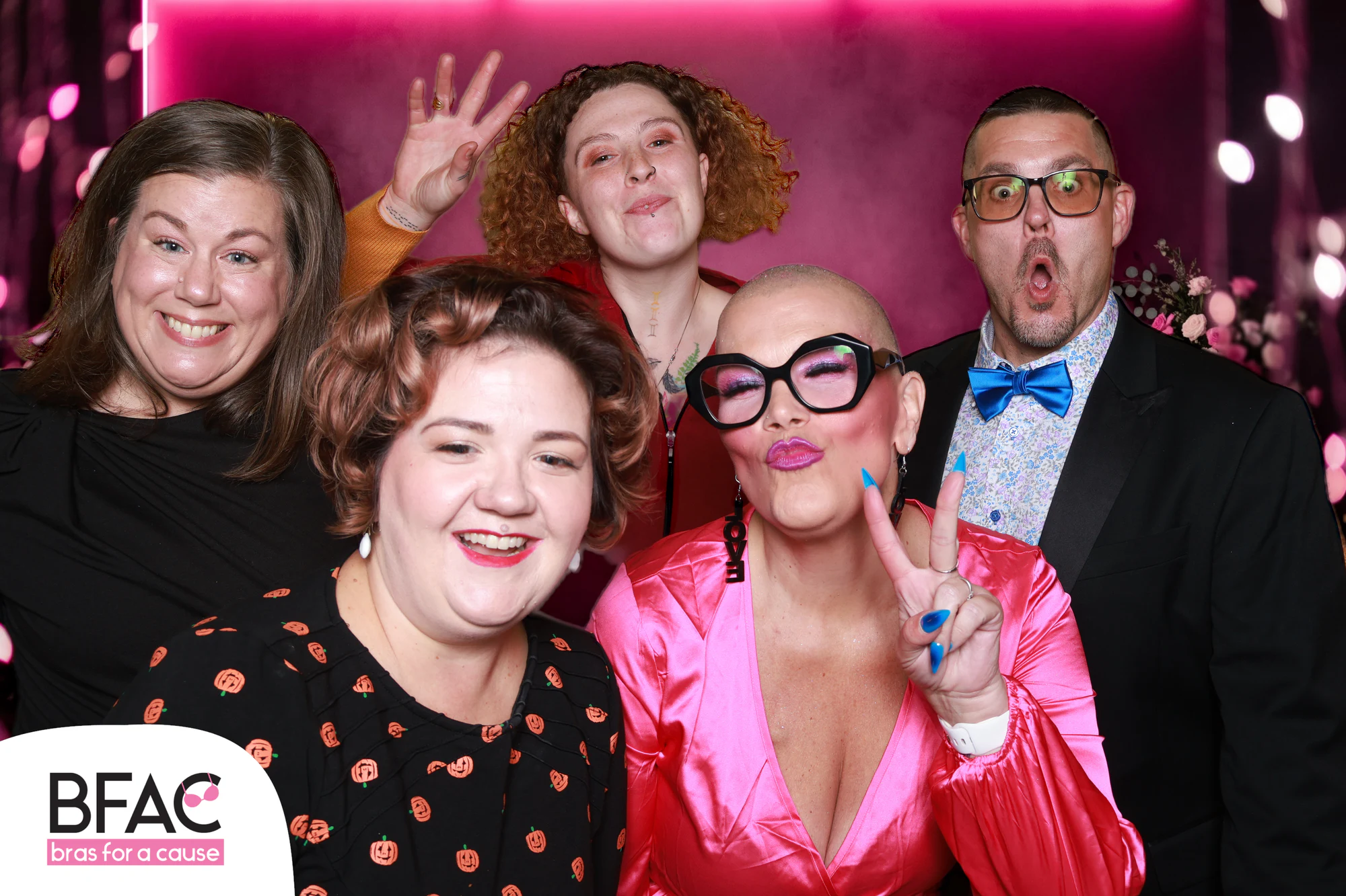 The six friends pulling faces, one man with his mouth wide open at Bras for a Cause 2026