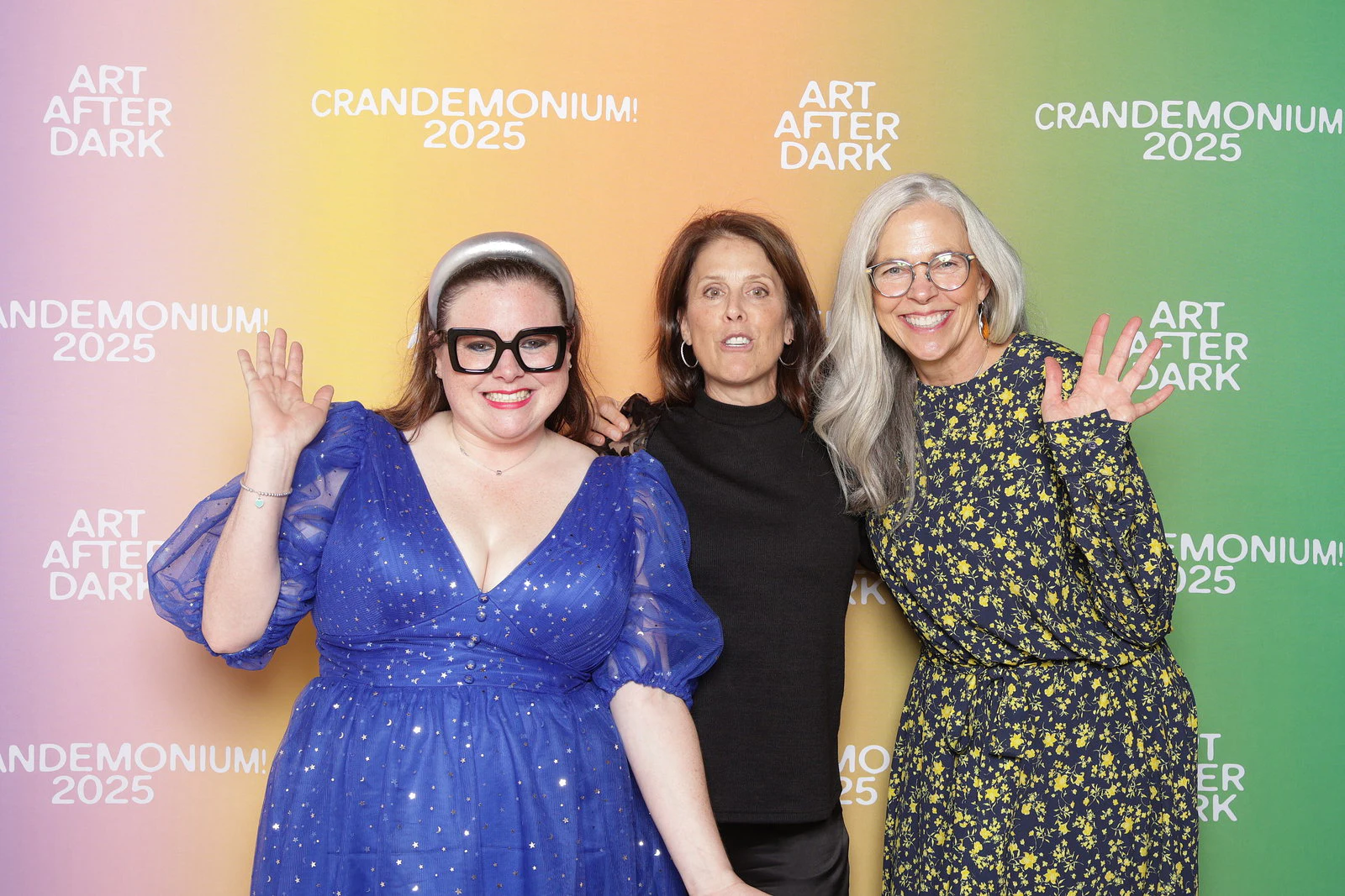 The three women waving at the camera at Crandemonium 2025