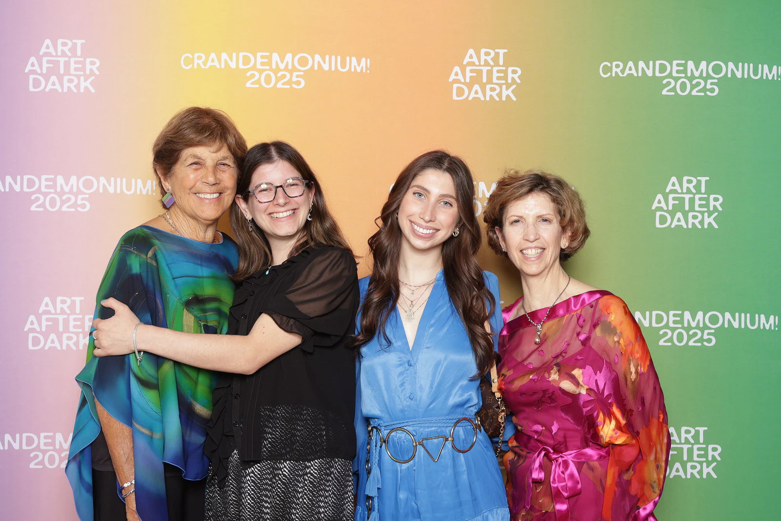 The four women hugging and smiling at Crandemonium 2025