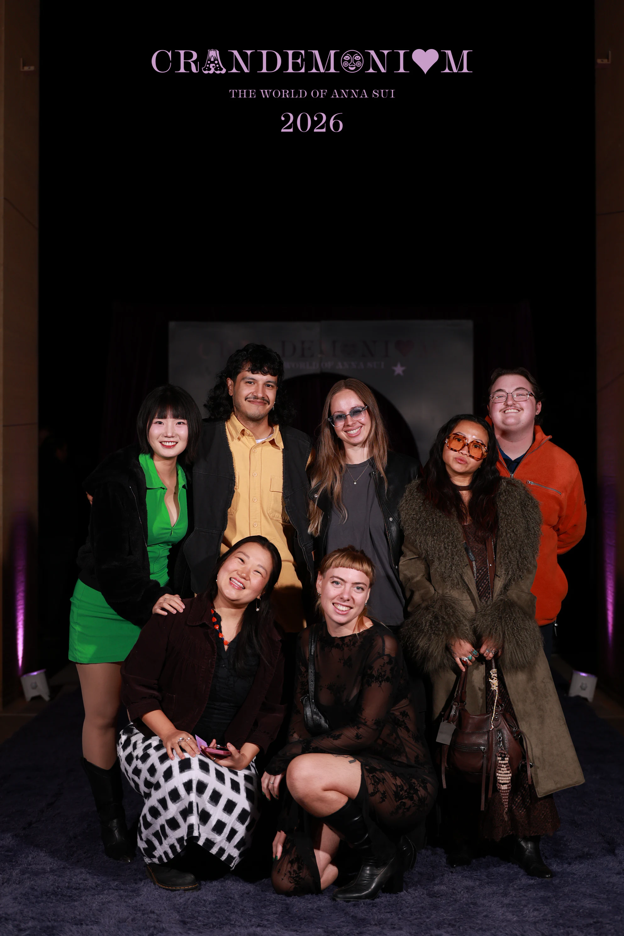 The nine guests posing again in front of the arch at Crandemonium 2026