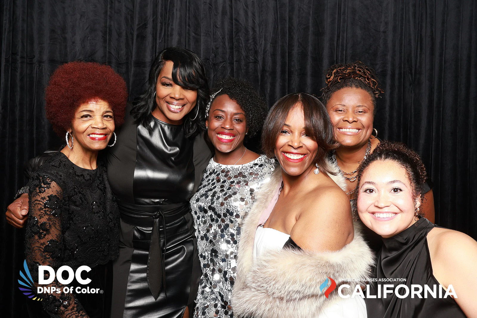 The seven women in a line, all smiling at DNPs of Color