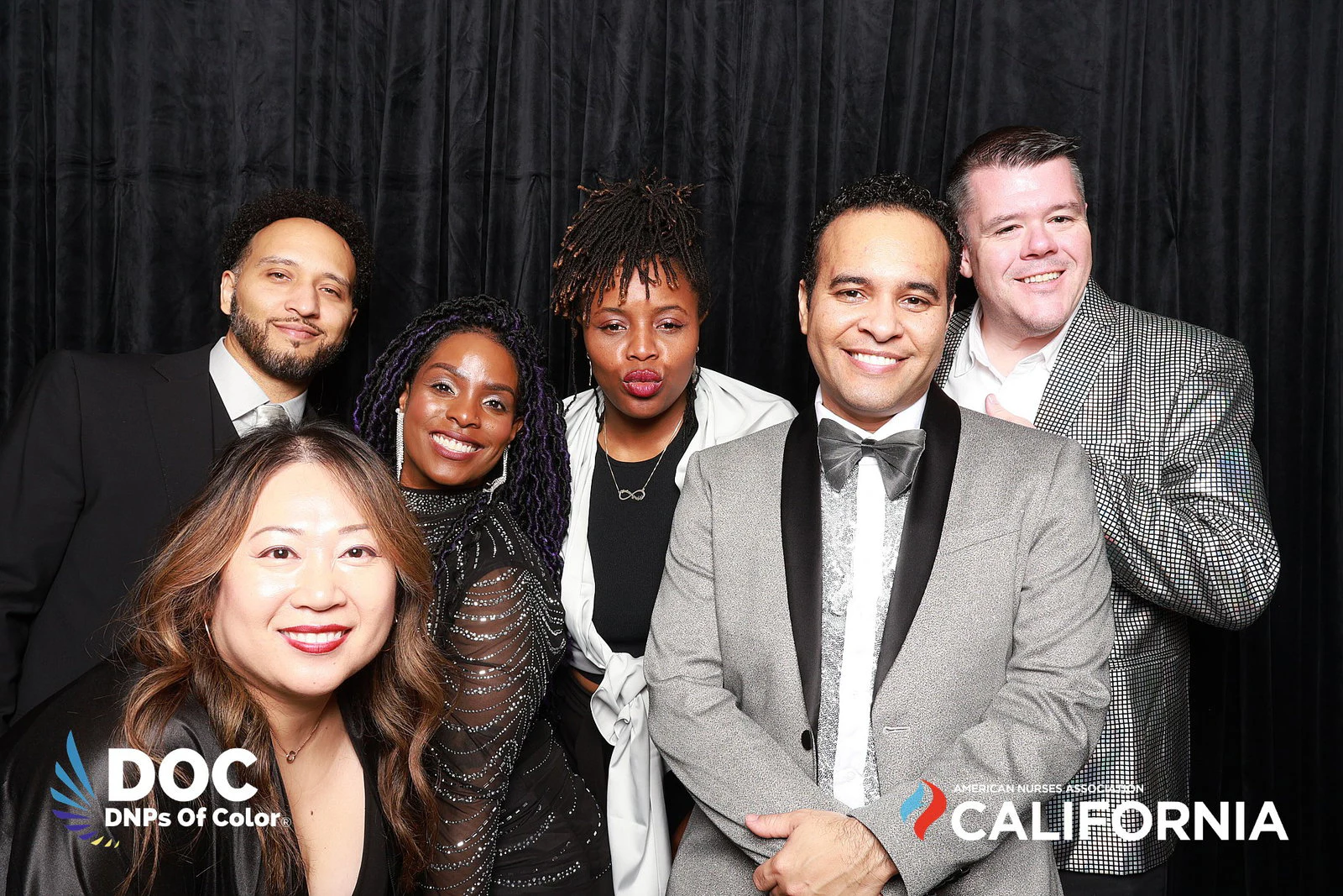 The seven guests standing together, smiling at DNPs of Color