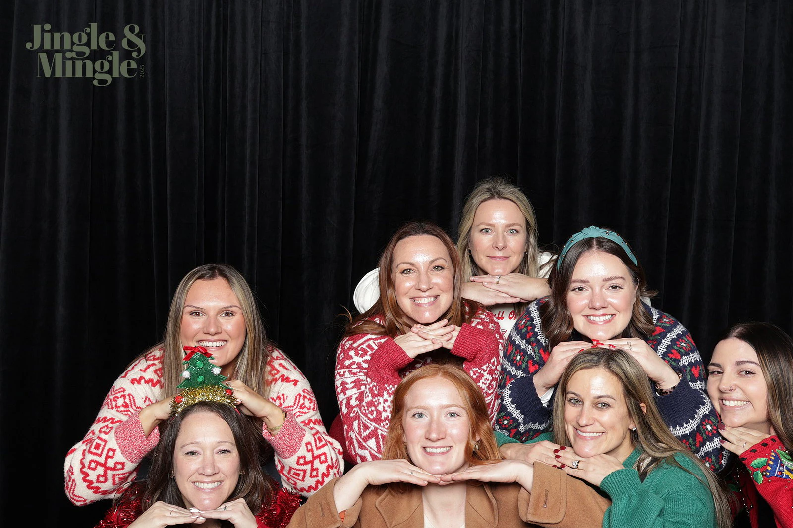 Eight women stacked in rows, hands folded under their chins at Dwyer Marble and Stone