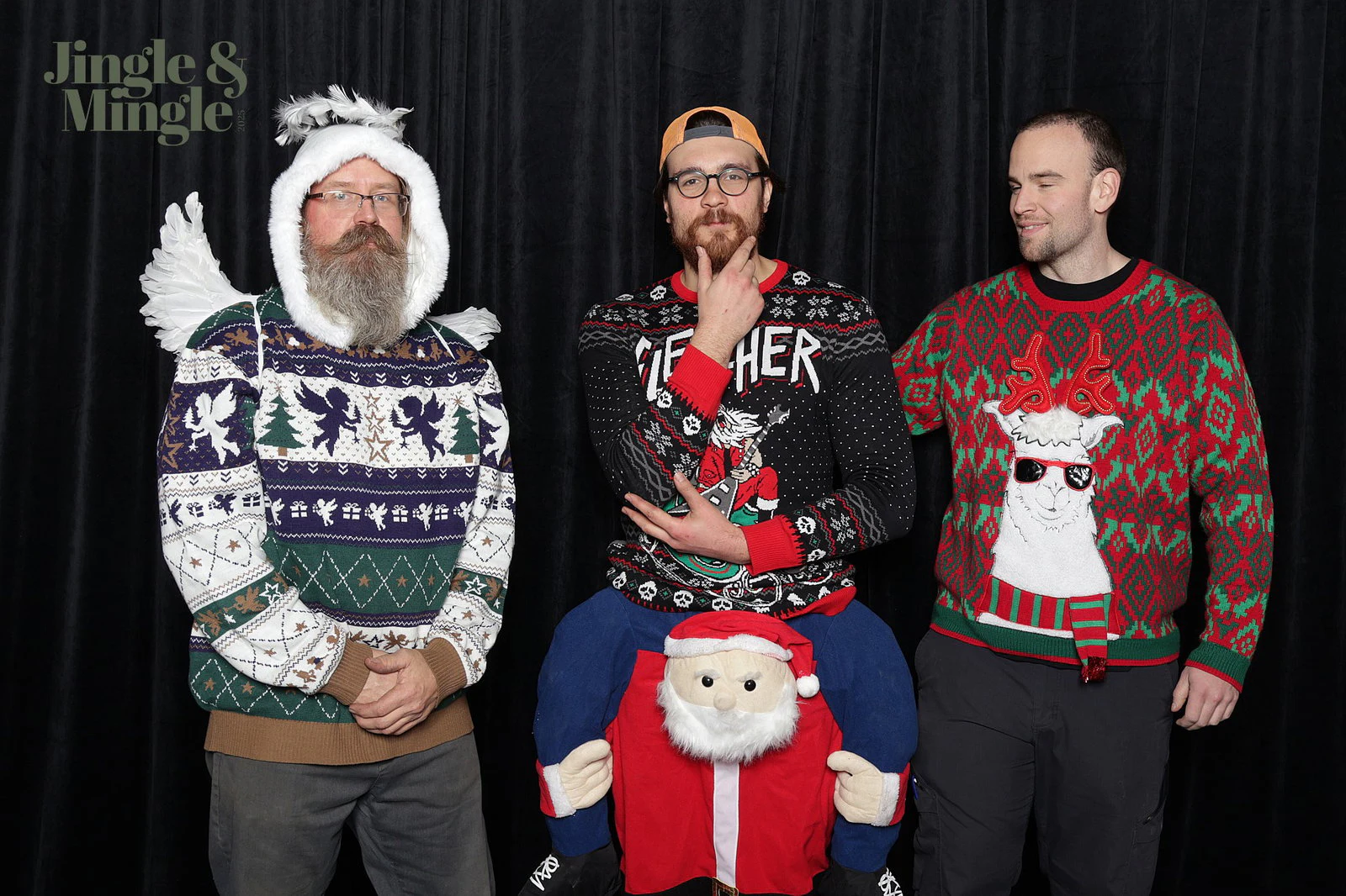 Three men in loud Christmas sweaters, one in a winged white hood and one riding a Santa costume at Dwyer Marble and Stone