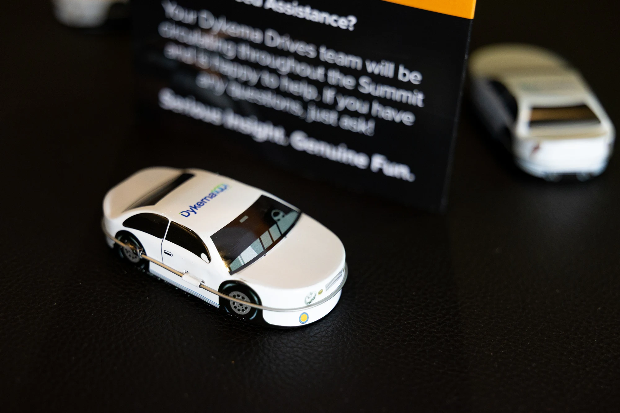 Dykema-branded model cars on the table at Dykema Automotive Legal Summit 2026