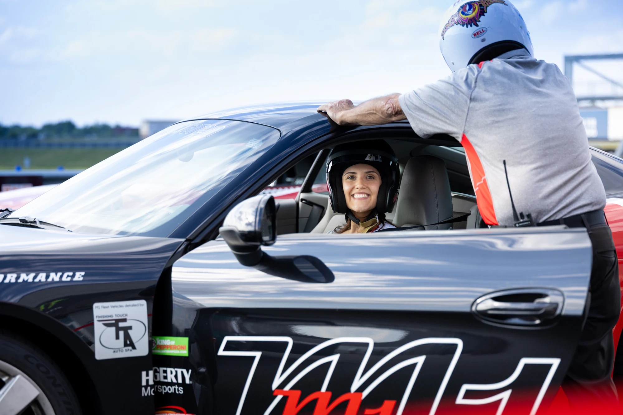 Guest in the driver seat grinning at Dykema Automotive Legal Summit 2026