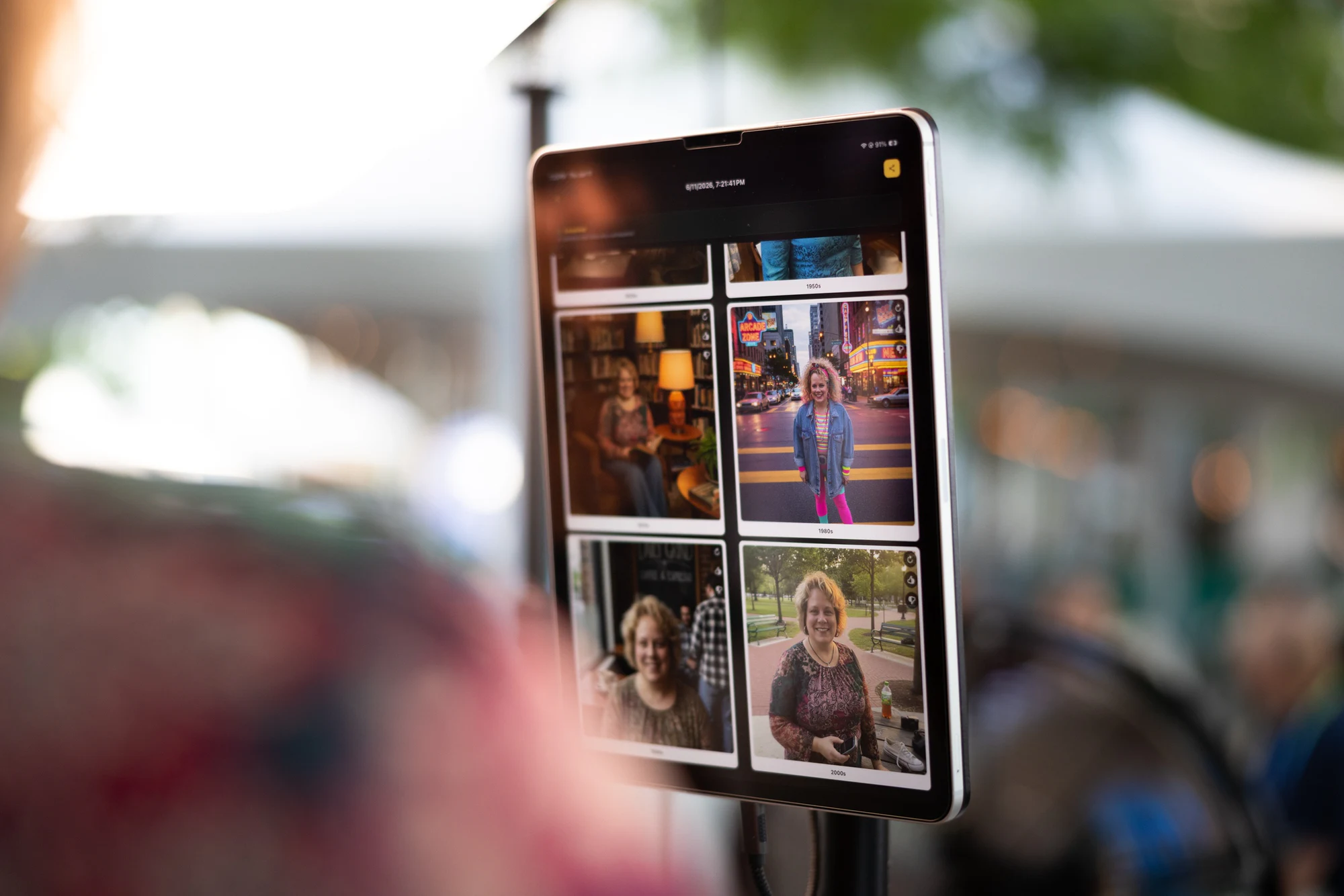 The tablet showing a guest’s decade portraits at the Dykema Centennial Celebration