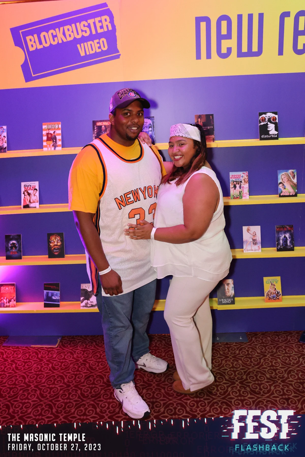 A couple in nineties sportswear at the video-store wall at the FEST Halloween party at the Masonic Temple