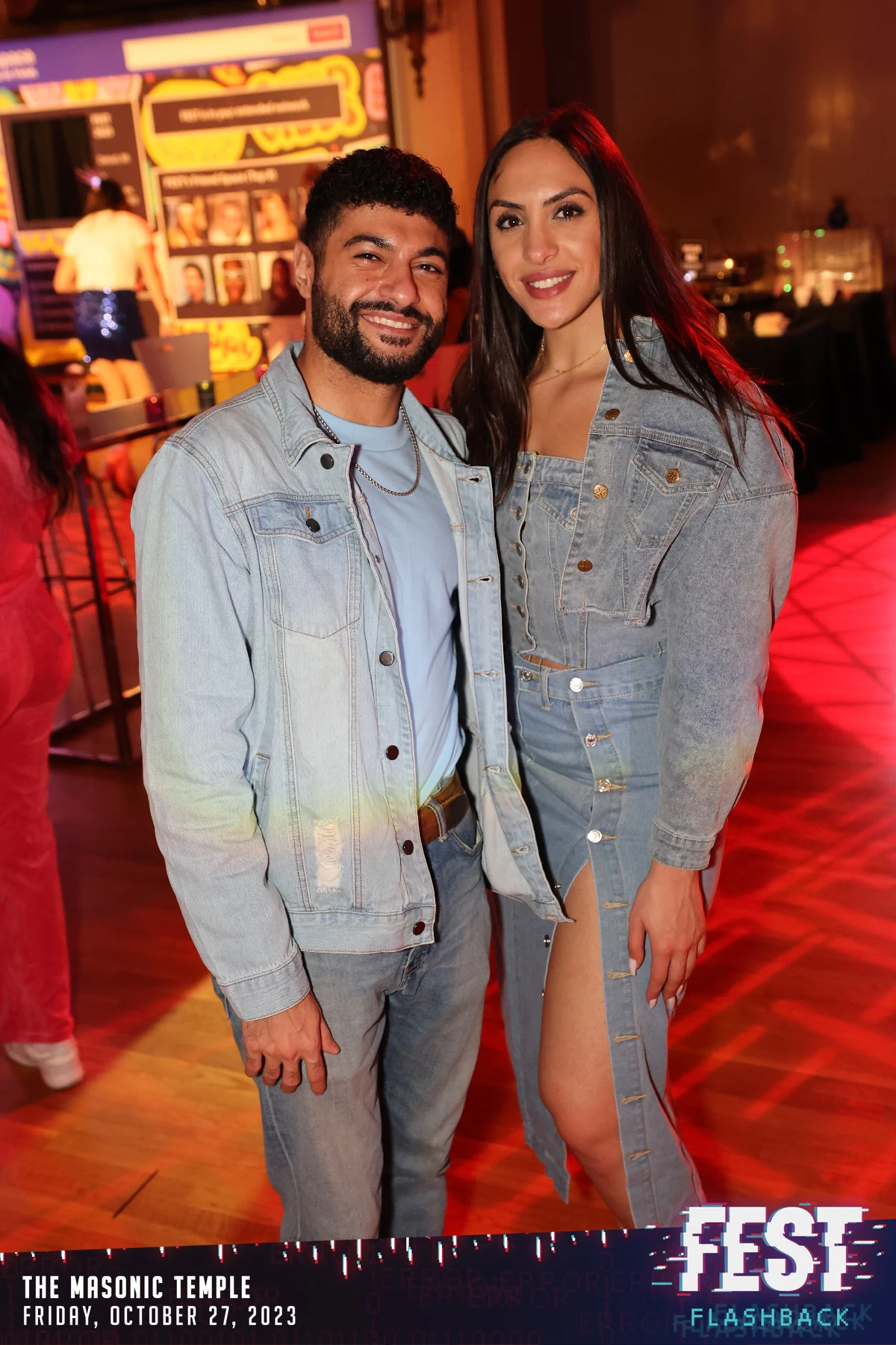 A couple in matching double denim at FEST Halloween Party at the Masonic Temple