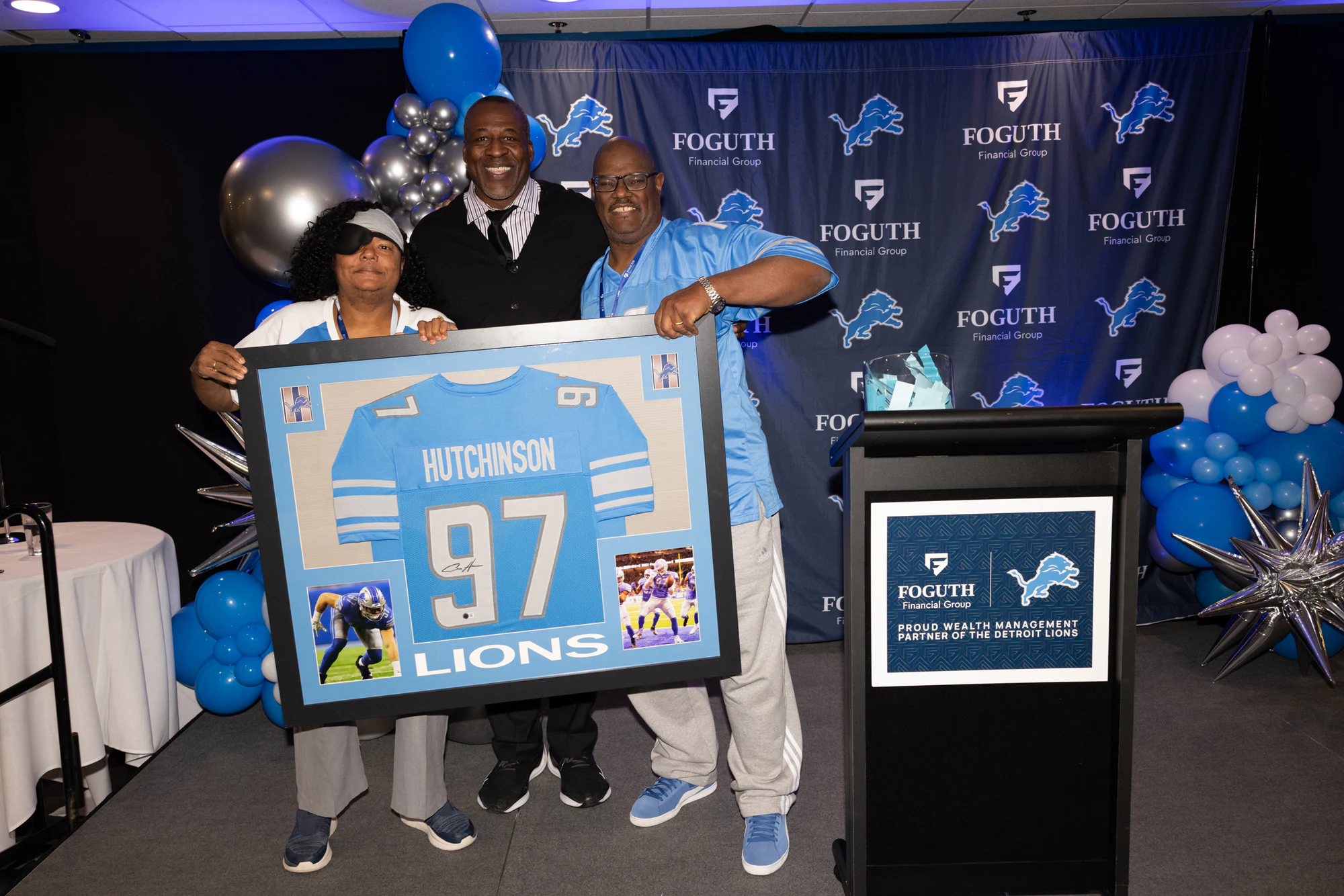 Winner with the framed #97 jersey at Foguth Financial at Ford Field