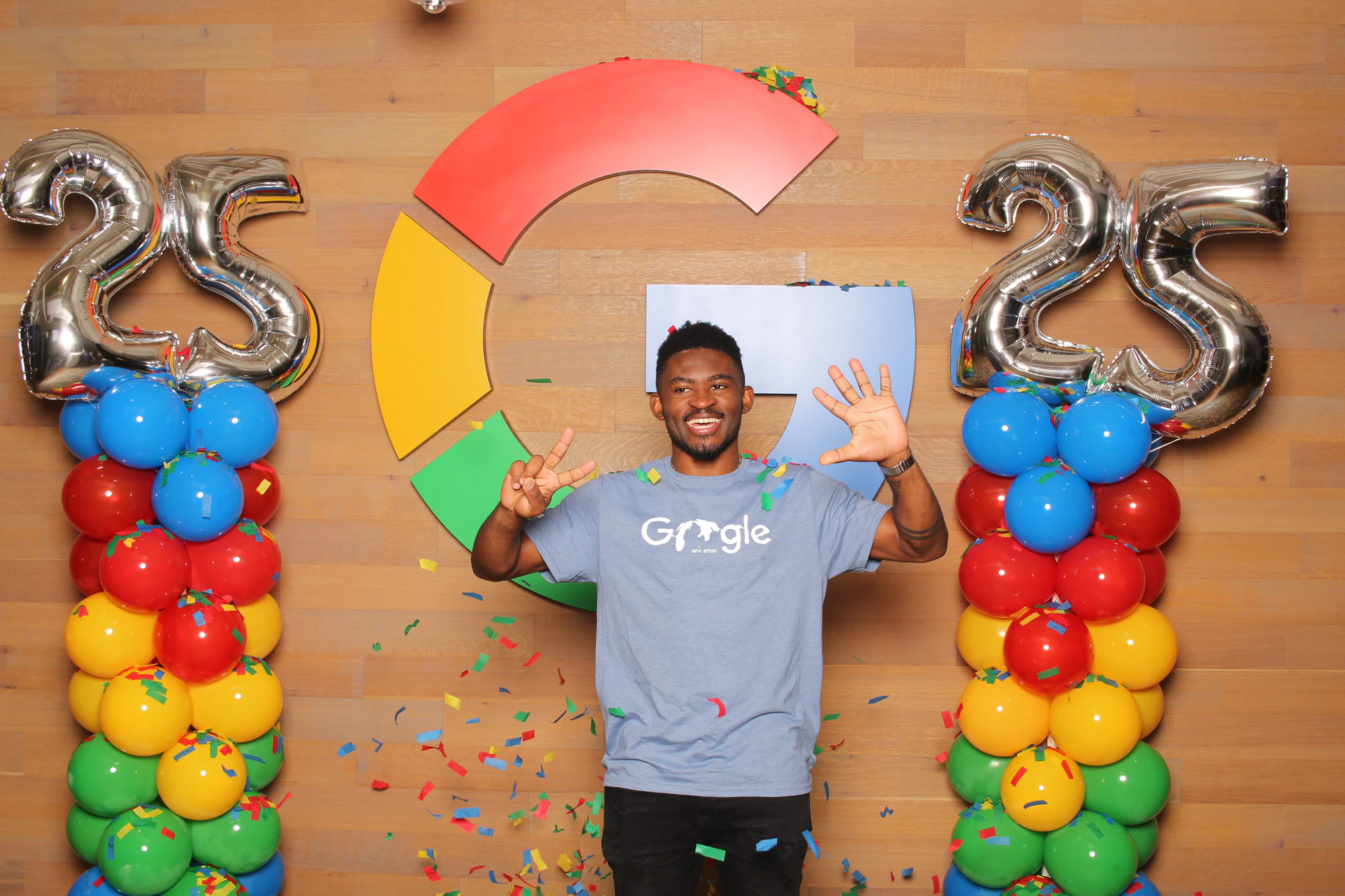 The same man with both hands up, grinning at Google’s 25th Birthday