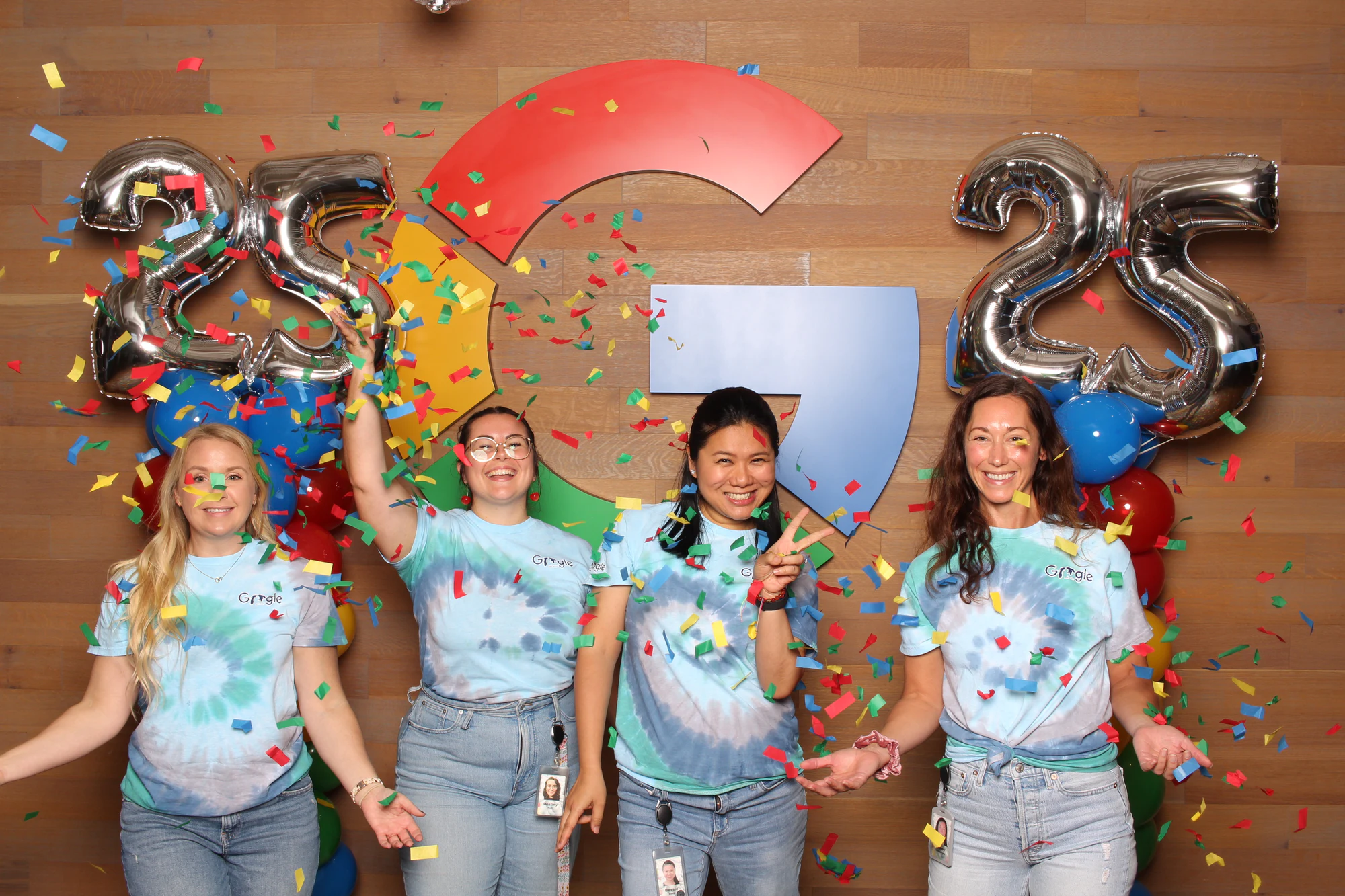 The four laughing with confetti on their shirts at Google’s 25th Birthday