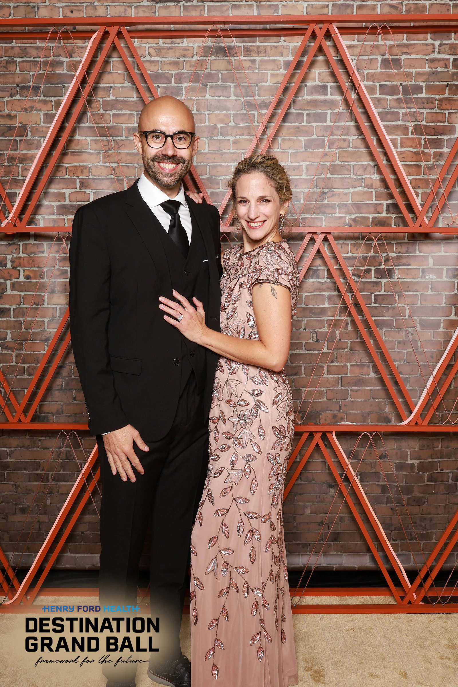 The couple standing arm in arm, smiling at Henry Ford Health Grand Ball