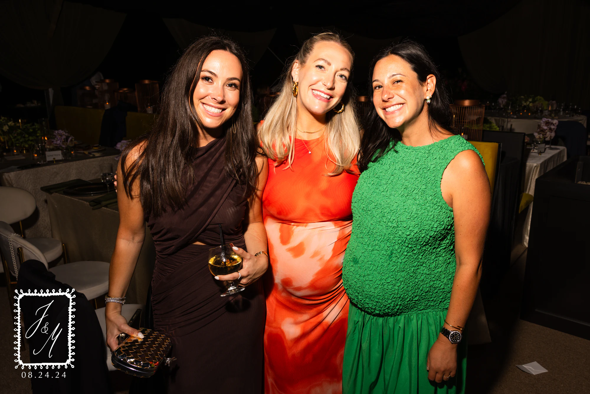 Three guests in brown, orange and green dresses at Jaclyn + Michael at Franklin Hills Country Club