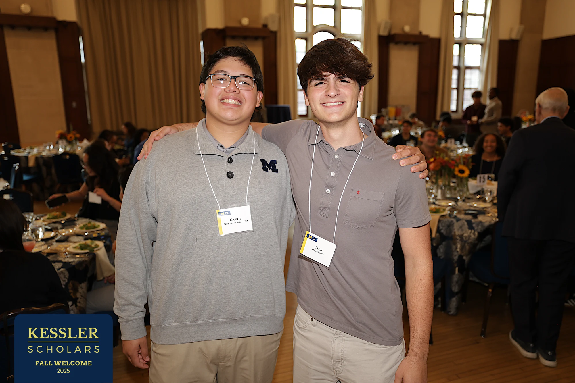 Two friends side by side, relaxed at Kessler Scholars Welcome Dinner