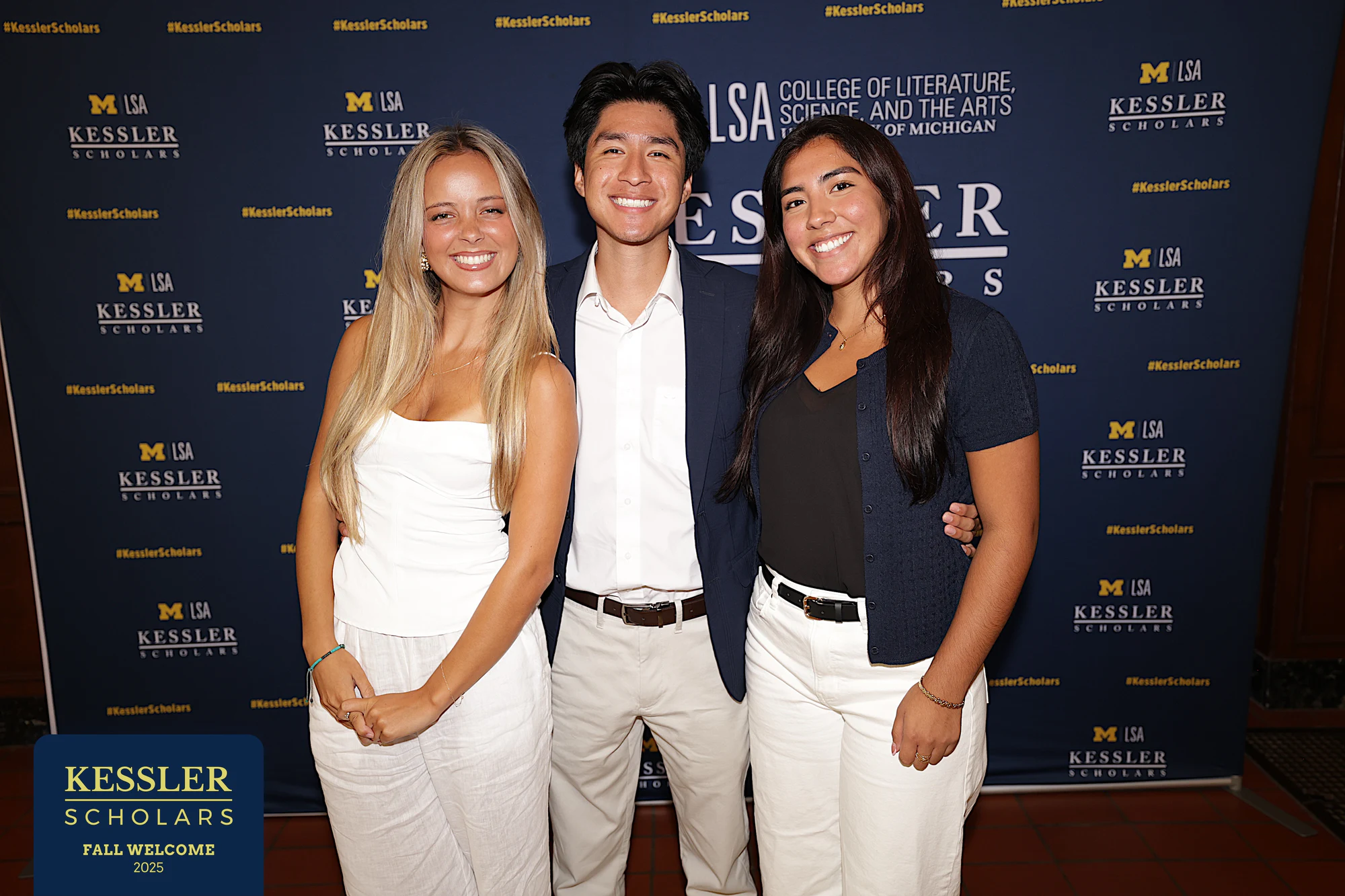 Three at the Kessler wall at Kessler Scholars Welcome Dinner