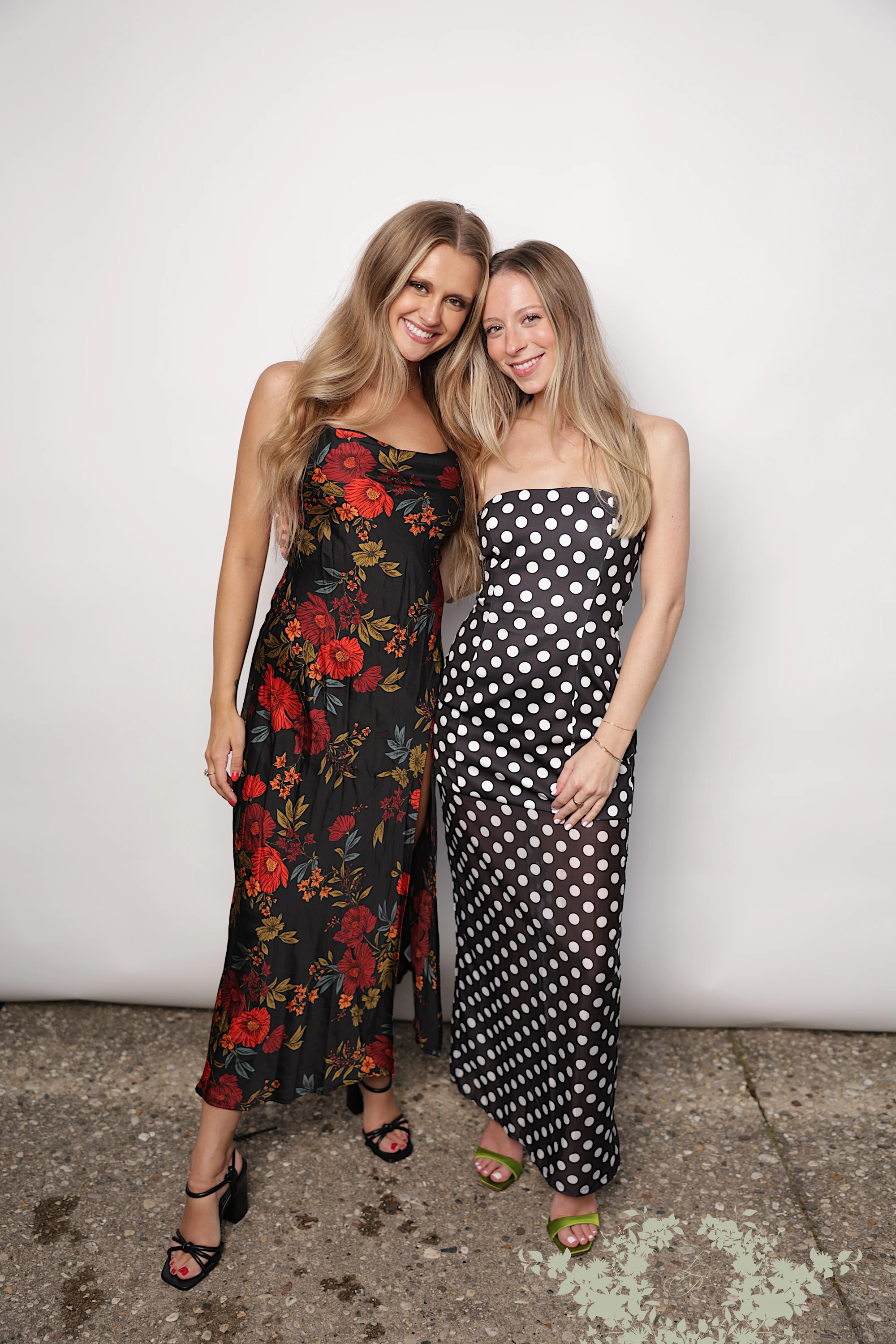 Two women in print dresses, full length at Lindsay + Ryan