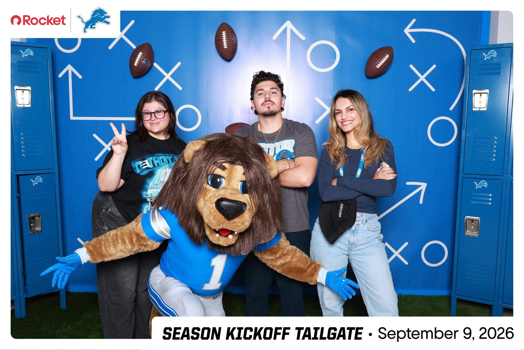 The mascot lunging toward the lens in front of three guests at Lions Season Launch Week